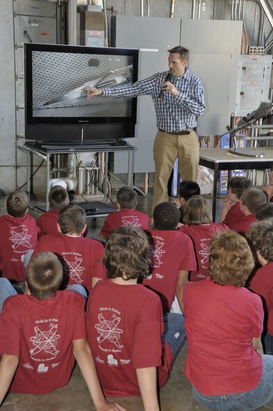 Dr. Rich Roberts, project manager in the 716th Test Squadron, explains test footage of a model installed in the center’s 16-foot transonic tunnel. (Photo by Rick Goodfriend)