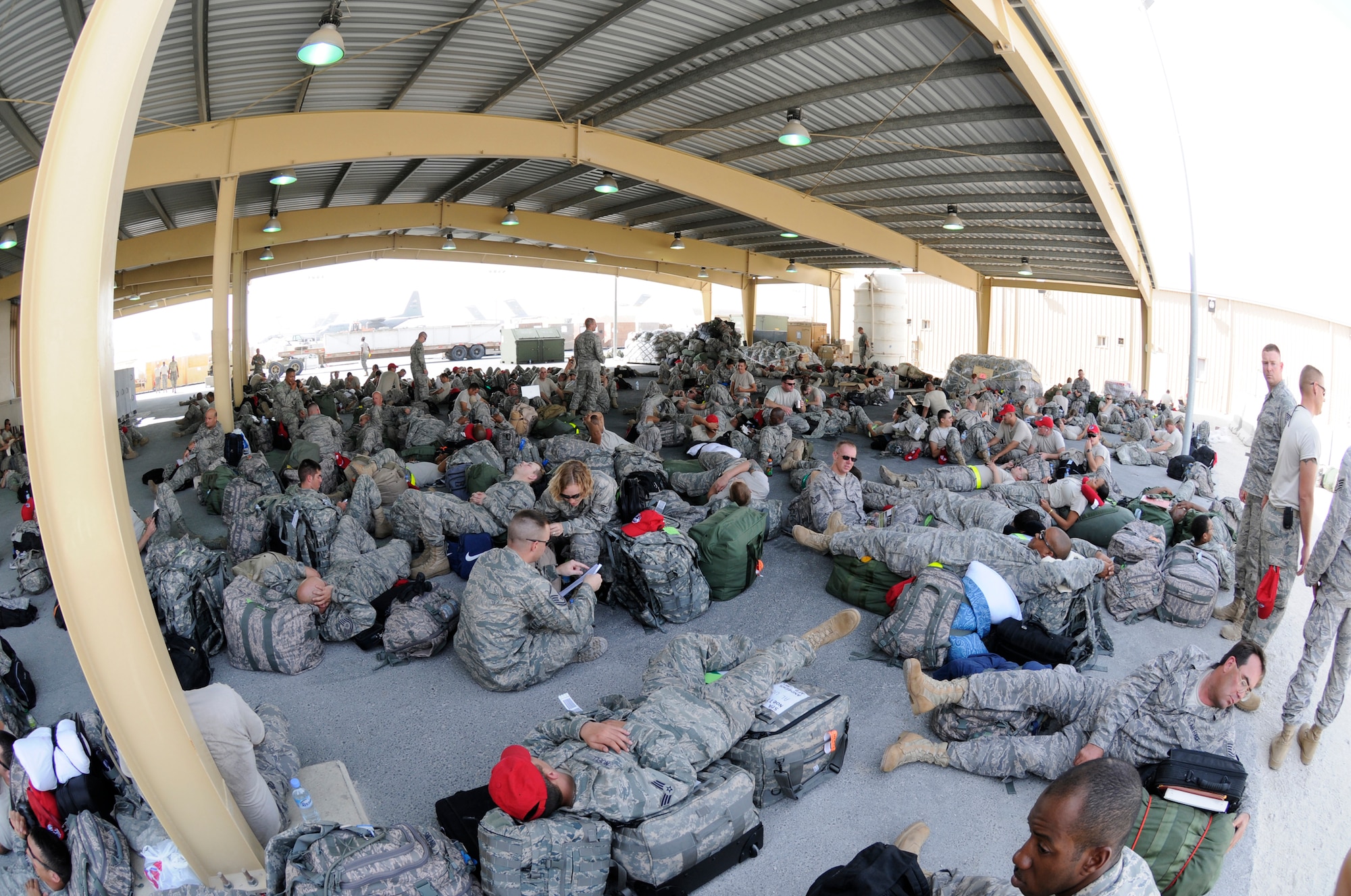 Rapid Engineer Deployable Heavy Operational Repair Squadrons Engineer (RED HORSE) personnel figure out ways to pass the time before in processing at an undisclosed air base in Southwest Asia October 2, 2008.  About 250 RED HORSE members will be transiting from here to bases in Iraq and Afghanistan in support of Operations Iraqi and Enduring Freedom.  They must in process the base, pass through customs, and then stay in transient quarters until their next flight is ready.  (U.S. Air Force photo by Tech. Sgt. Michael Boquette/Released)