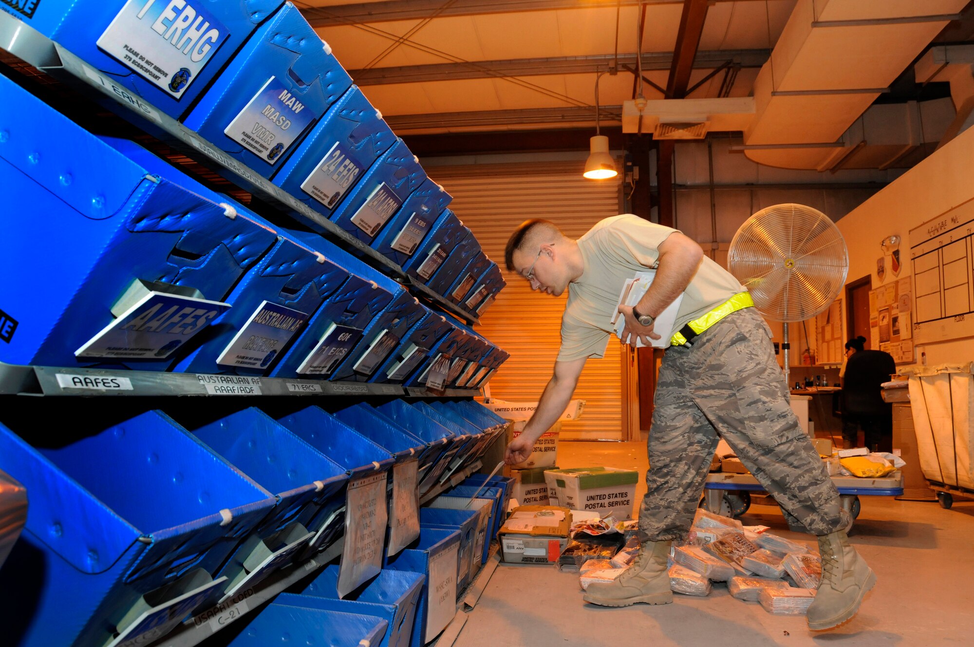 Senior Airman Jonathon Collins, 379th Expeditionary Communications Squadron, drops some personal mail into a squadron bin for pick up by a unit mail clerk October 2, 2008.  The mail is sorted seven mornings a week at this undisclosed air base in Southwest Asia.  Airman Collins is a native of Fergus Falls, Minn., and is deployed from Incirlik, Air Base, Turkey, in support of Operations Iraqi and Enduring Freedom and Joint Task Force-Horn of Africa.  (U.S. Air Force photo by Tech. Sgt. Michael Boquette/Released)