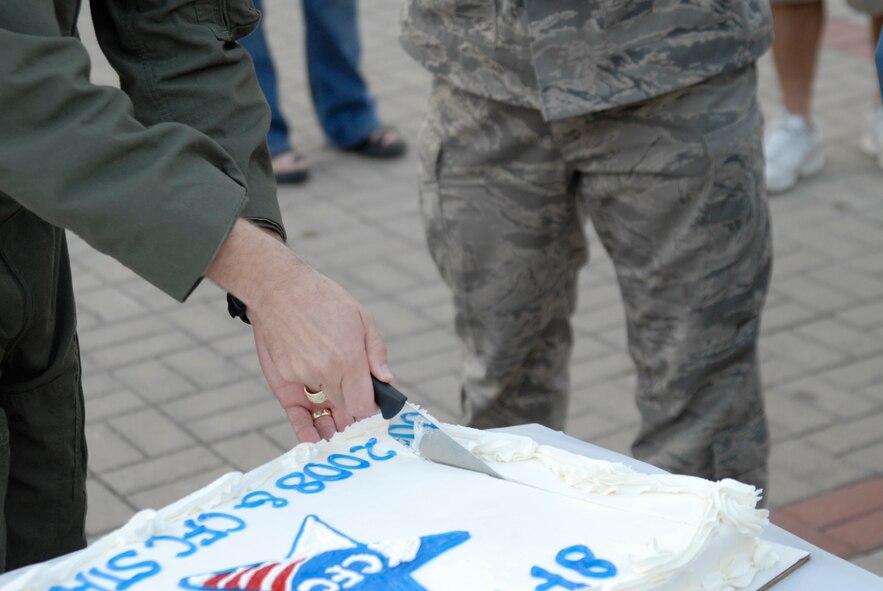 Colonel Bryan "Wolf" Bearden, 8th Fighter Wing Commander, cuts the cake during the kickoff of the Combined Federal Compaign  at Kunsan Air Base, S. Korea, 01 October 2008. (U.S. Air Force photo/Staff Sgt. Jason Colbert)