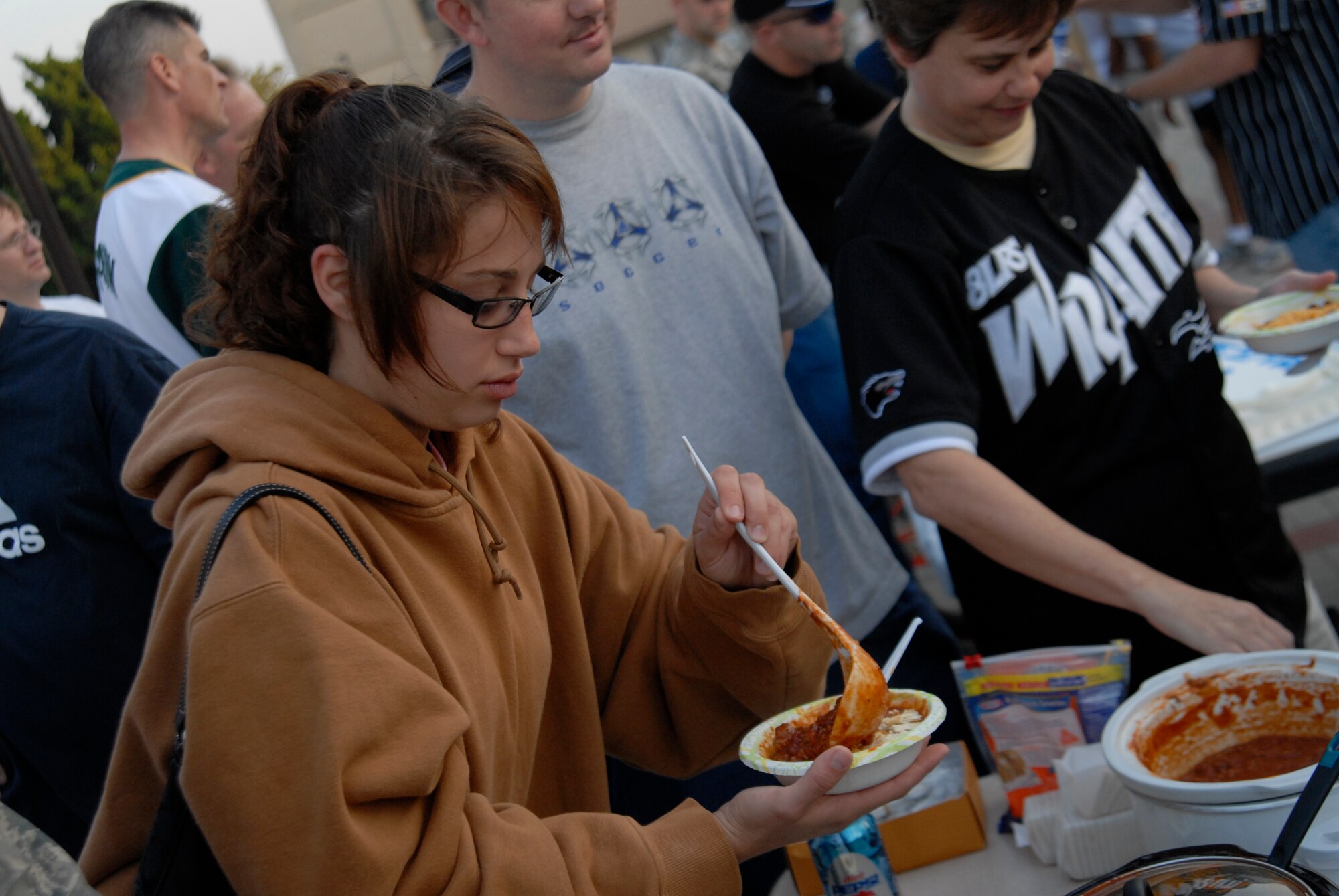 SrA Chanin Williams, 8 LRS, samples chilli during the kickoff of the Combined Federal Compaign  at Kunsan Air Base, S. Korea, 01 October 2008. . (U.S. Air Force photo/Staff Sgt. Jason Colbert)