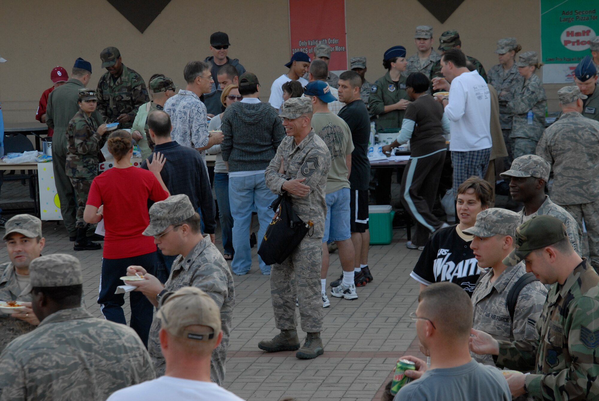 A crowd comes to taste the chilli and hear the news during the kickoff of the Combined Federal Compaign  at Kunsan Air Base, S. Korea, 01 October 2008.  (U.S. Air Force photo/Staff Sgt. Jason Colbert)
