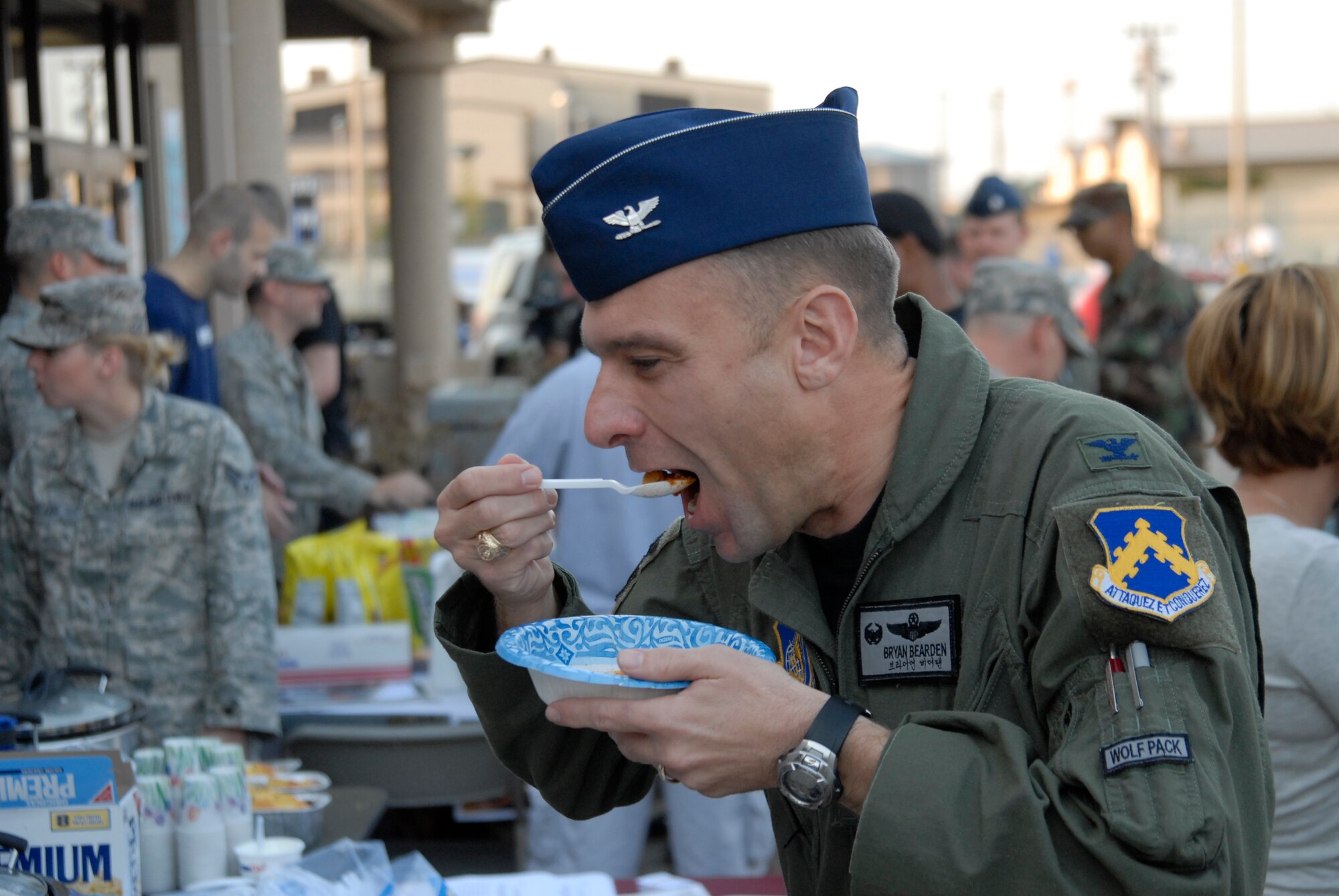Colonel Bryan "Wolf" Bearden, 8th Fighter Wing Commander, tastes chilli during the kickoff of the Combined Federal Compaign  at Kunsan Air Base, S. Korea, 01 October 2008.  (U.S. Air Force photo/Staff Sgt. Jason Colbert)