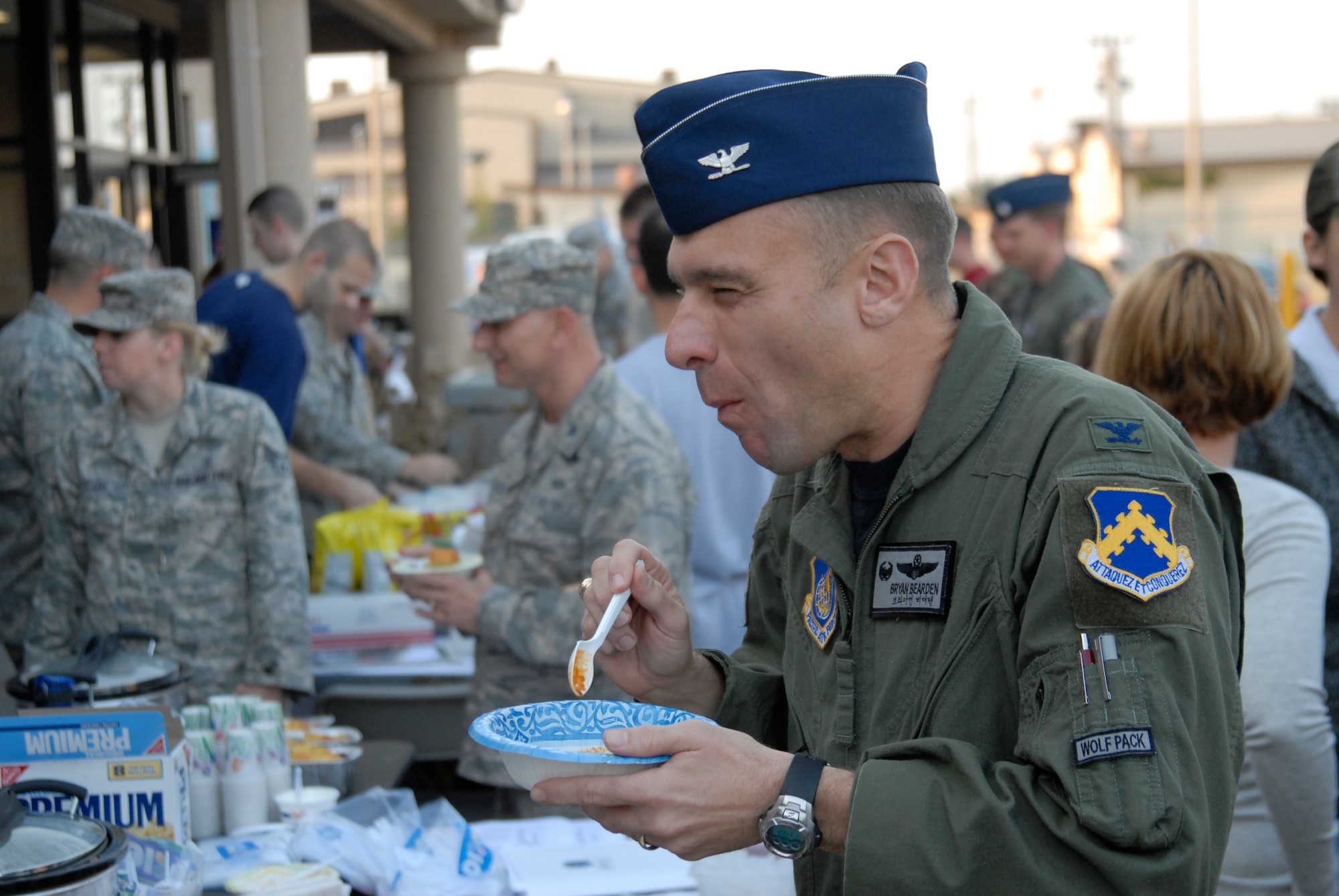 Colonel Bryan "Wolf" Bearden, 8th Fighter Wing Commander, savors the chilli of SSgt Terry Snider, 80 AMU crew cheif, during the kickoff of the Combined Federal Compaign at Kunsan Air Base, S. Korea, 01 October 2008. (U.S. Air Force photo/Staff Sgt. Jason Colbert)