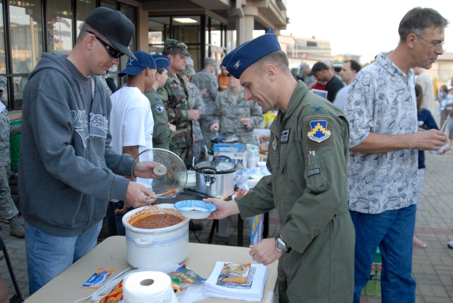 SSgt Terry Snider, 80 AMU Crew Chief, serves chilli to Colonel Bryan "Wolf" Bearden, 8th Fighter Wing Commander, during the kickoff of the Combined Federal Compaign at Kunsan Air Base, S. Korea, 01 October 2008.  (U.S. Air Force photo/Staff Sgt. Jason Colbert)