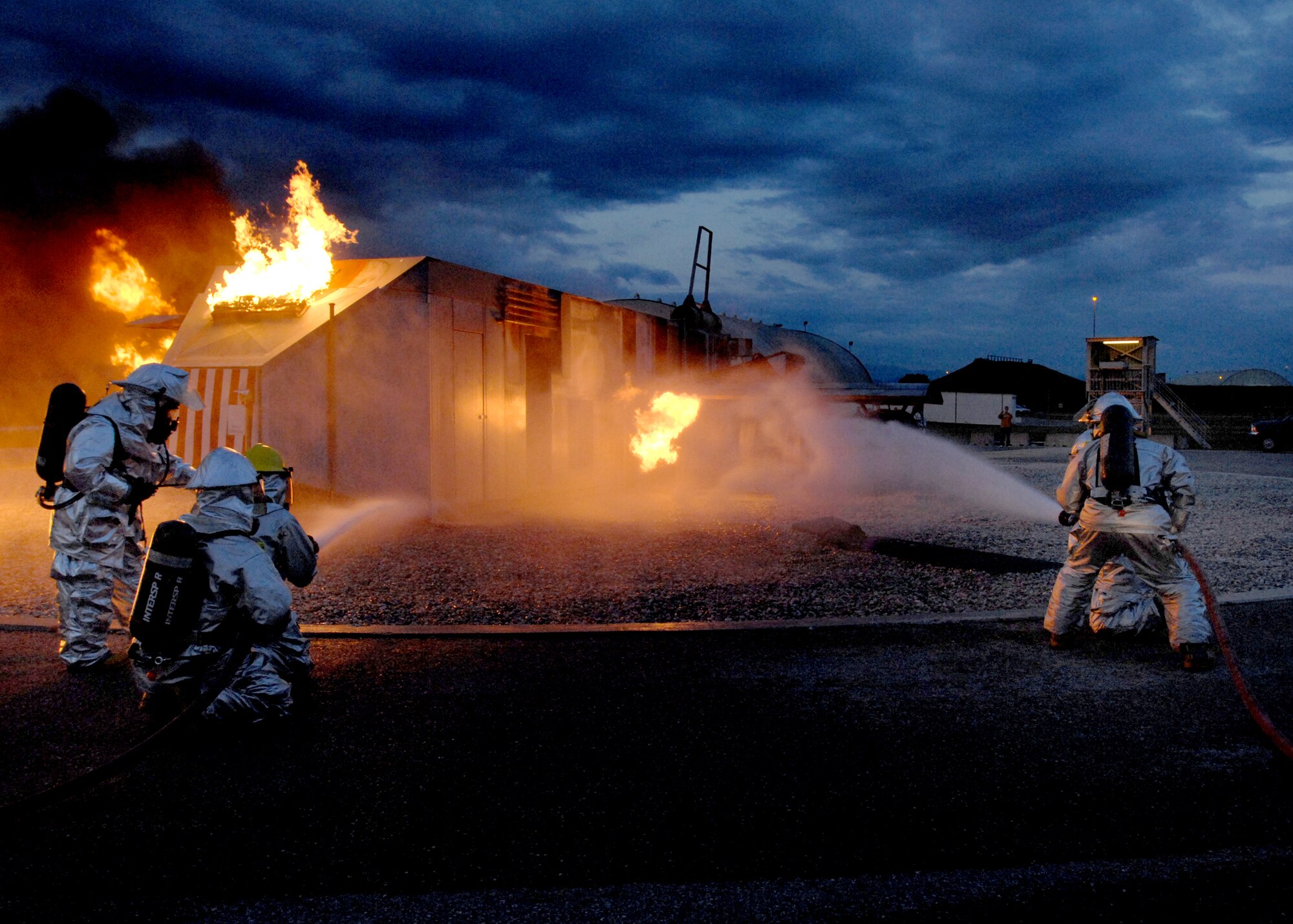 AVIANO AIR BASE, Italy --  Aviano Firefighters do live burn training at the outdoor fire training facility Sept. 23.  Controlled outdoor burns allow firefighters to maximize training by utilizing to most realistic simulated environment.  (U.S. Air Force photo/Airman 1st Class Tabitha M. Mans)