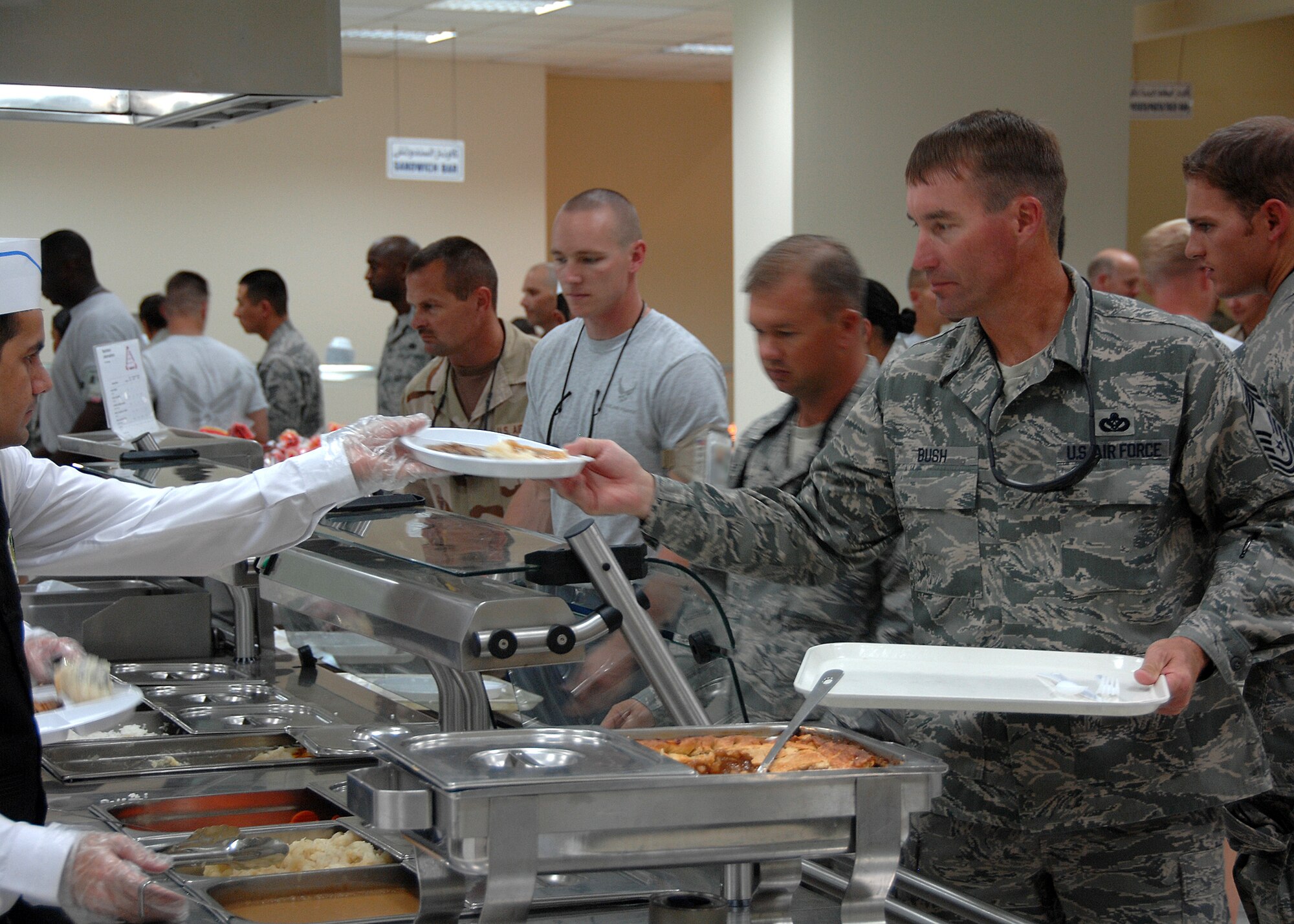 SOUTHWEST ASIA -- Lunchtime rush at the 386th Expeditionary Force Support Squadron Dining Facility (DFAC) on Oct. 1 at an air base in Southwest Asia. The 386th EFSS DFAC serves over 4,500 meals daily to servicemembers, making it one of the largest dining facilities in the U.S. Central Command area of responsibility. (U.S. Air Force photo/Tech. Sgt. Raheem Moore)