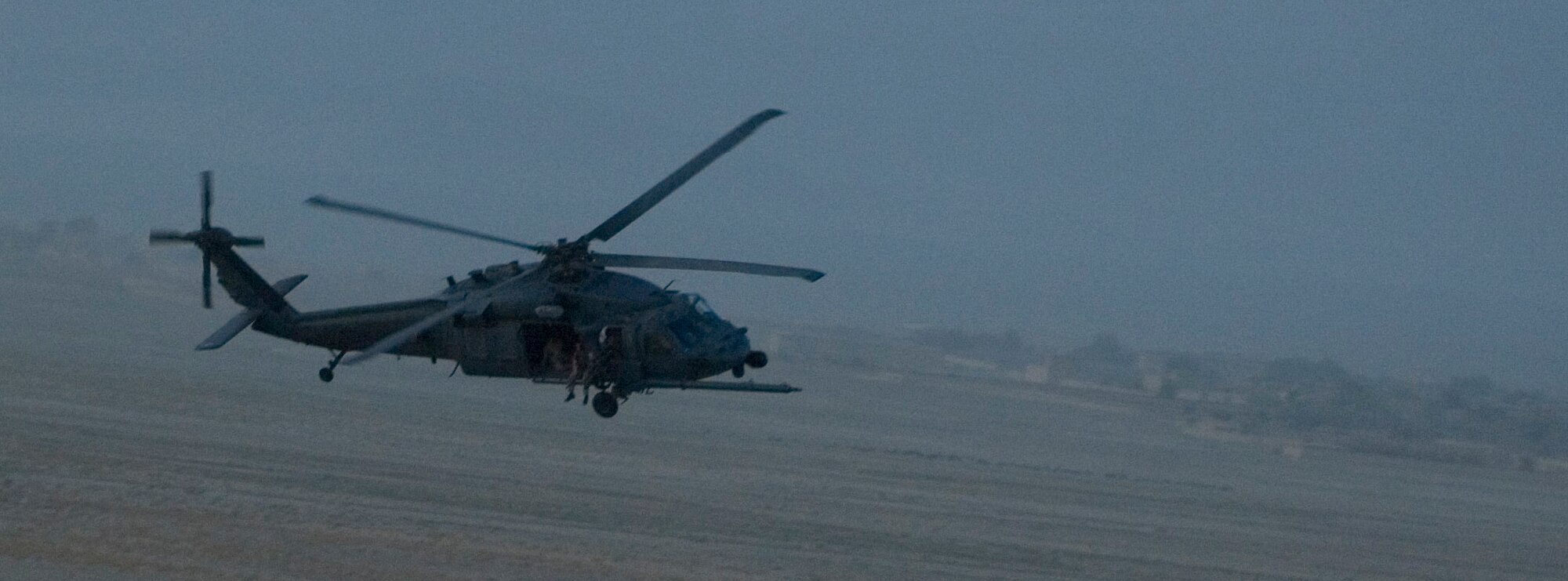 A HH-60 Pave Hawk conducts combat search and rescue training mission near Bagram Air Field, Afghanistan, Sept. 25. The training mission was conducted with support from the Army’s AH-64 Apaches in an effort to integrate operations in high threat environments. (U.S. Air Force photo by Staff Sgt. Rachel Martinez/Released)