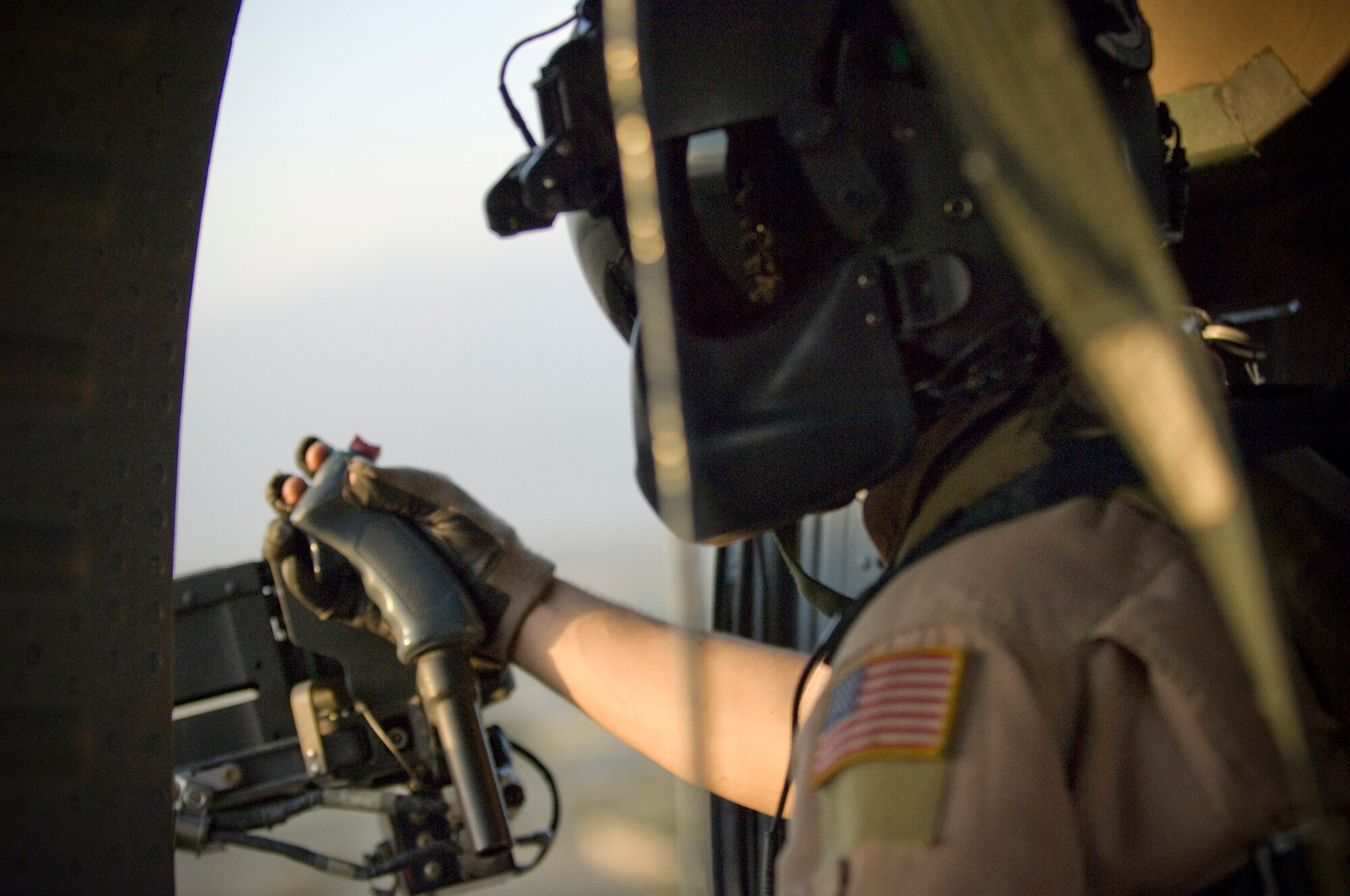 Senior Airman Chris Bridges, a HH-60 Pave Hawk gunner for the 33rd Expeditionary Rescue Squadron, scans the horizon for any threats during a combat search and rescue mission near Bagram Air Field, Afghanistan, Sept. 25. The 33rd ERQS was conducting training for integrated operations with the Army’s AH-64 Apache for CSAR in high threat environments. (U.S. Air Force photo by Staff Sgt. Rachel Martinez/Released)