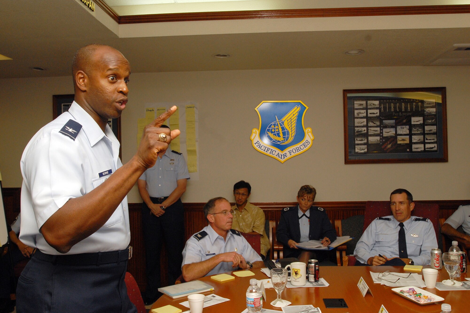 Colonel Cedric George, director of Pacific Air Forces AFSO 21, speaks to 18th Wing senior leadership during a SWOT analysis session held at Kadena Air Base, Japan Sept. 29, 2008. The session allowed Kadena leaders to assess the base's strengths and weaknesses in order more effectively align goals and priorities with those of PACAF and the Air Force. (U.S. Air Force photo/Airman 1st Class Chad Warren)