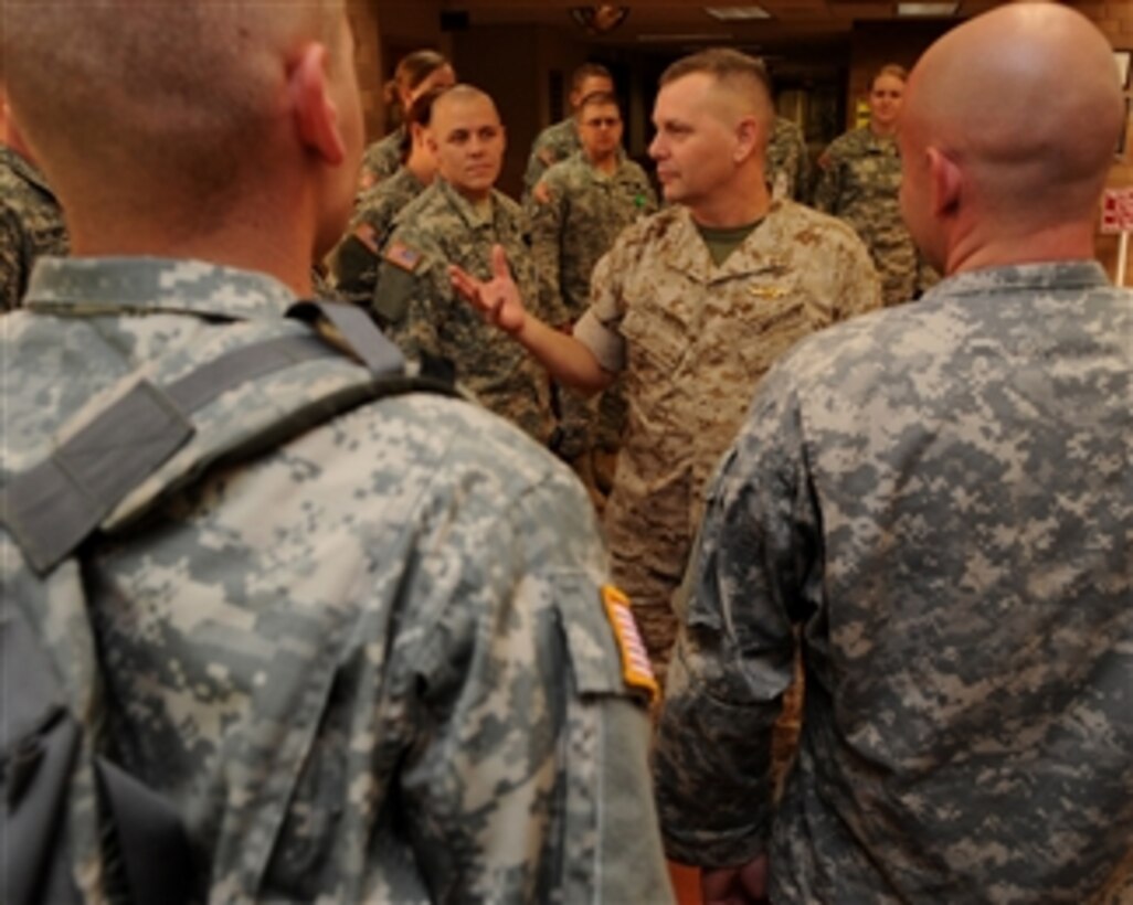 Vice Chairman of the Joint Chiefs of Staff Gen. James E. Cartwright, U.S. Marine Corps, speaks with U.S. service members at Brook Army Medical Center in San Antonio, Texas, on Sept. 26, 2008.  Cartwright is touring the facility with professional wrestler Mick Foley visiting wounded warriors and learning about their health care.  