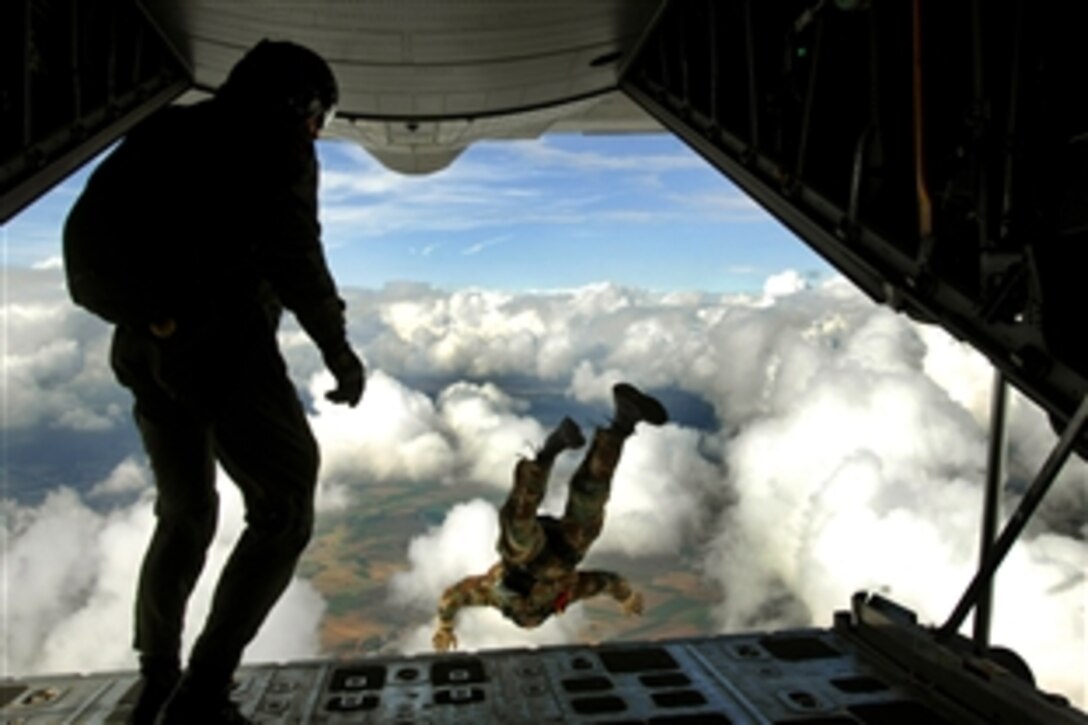 Preparing for an upcoming mission, pararescuemen jump out the back of a C-130 Hercules during jump training, Sept. 24, 2008, over southwestern Germany.  They are with the 786th Security Forces Squadron.