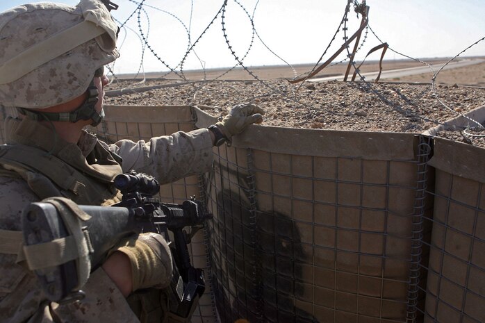 RAMADI, Iraq (Oct. 4, 2008) Cpl. Glen A. Brannen, a squad leader with Company G, 2nd Battalion, 9th Marine Regiment, holds security during a stop at a local Provincial Security Forces checkpoint Oct. 3. Marines of 1st Bn., 9th Marines, escorted their counterparts around the area of operations to familiarize them with Iraqi culture. (Official Marine Corps photo by LCpl. Jerry Murphy) (Released)