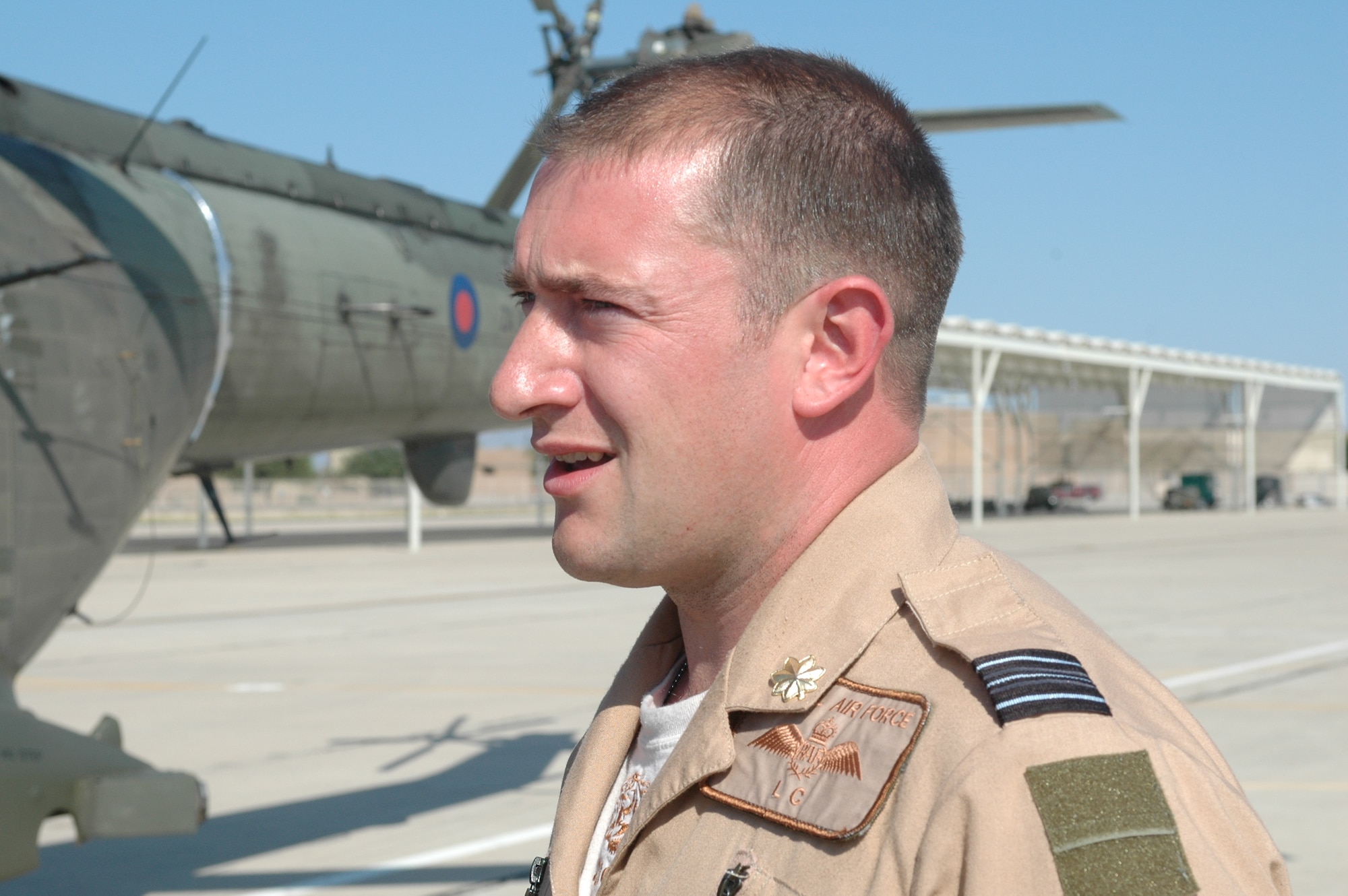 Squadron Leader Simon Elsey inspects his RAF Puma helicopter on the Snowbird ramp at Davis-Monthan Air Force Base Oct. 1. Two Pumas were delivered to D-M from the United Kingdom via C-17. The Puma is a medium-lift support helicopter used to transport between 12 and 16 fully equipped troops. (Air National Guard photo by Capt. Gabe Johnson)