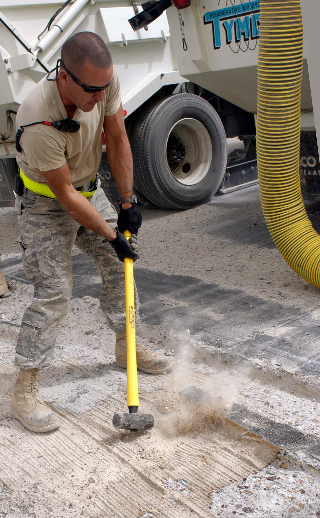 Staff Sgt. Ryan Ward breaks old concrete on a runway at Joint Base Balad, Iraq, to make way for new pavement Oct. 1. Ward, a pavements and construction equipment journeyman with the 332nd Expeditionary Civil Engineer Squadron and St. Louis native, is deployed from McConnell Air Force Base, Kan. (U.S. Air Force photo/Tech. Sgt. Craig Lifton)