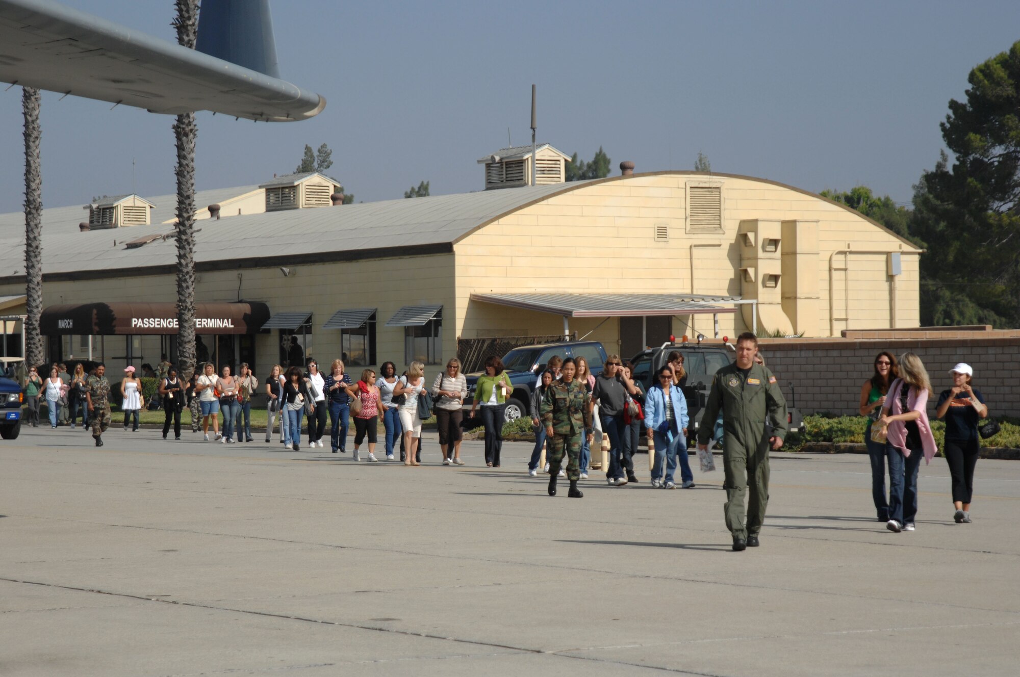 Military spouses wait to board a C-17 aircraft at March ARB during a Spouse’s Flight on Sunday. (U.S. Air Force photo by Senior Master Sgt. Kim Allain)