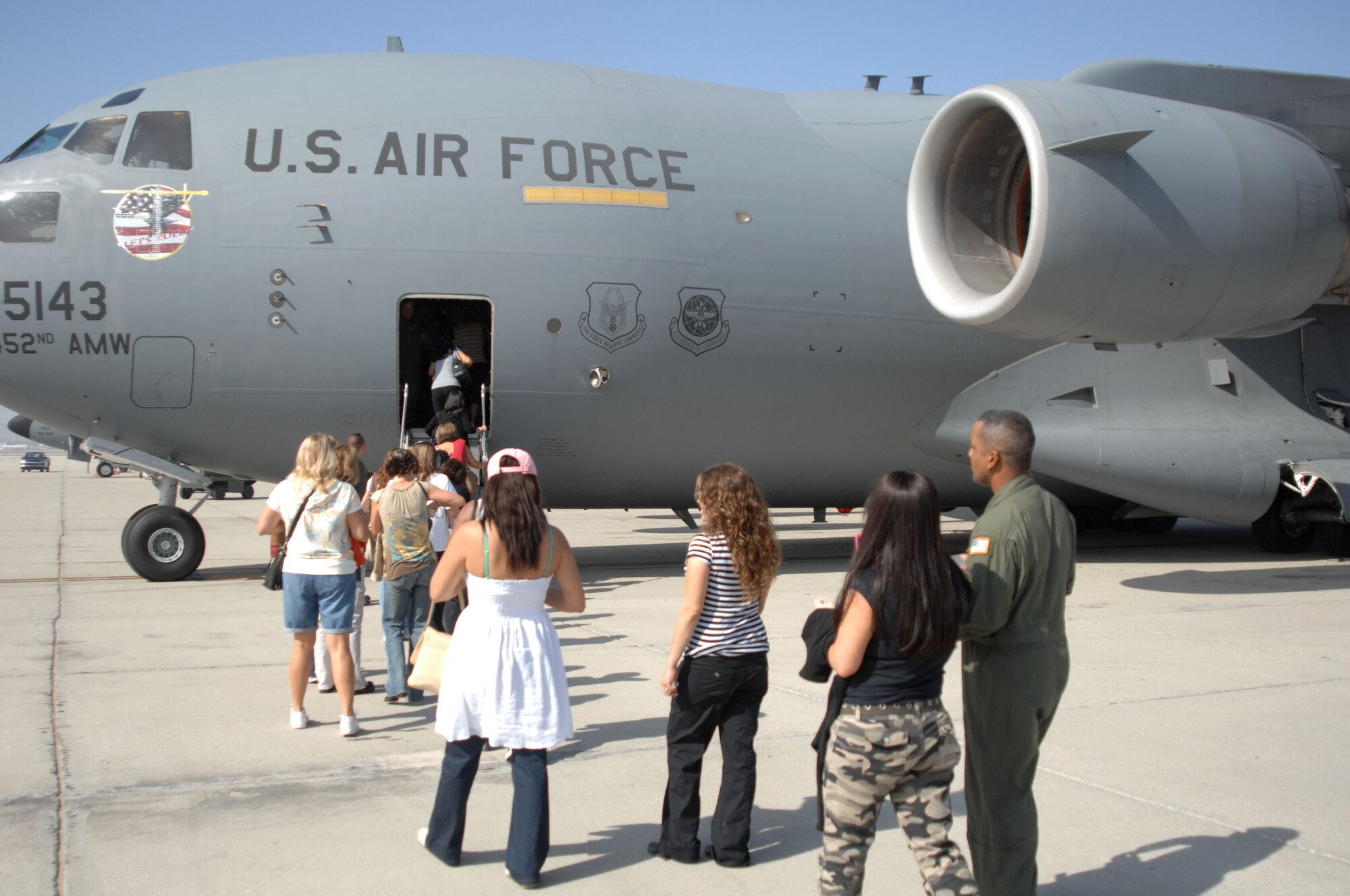 Military spouses wait to board a C-17 aircraft at March ARB during a Spouse’s Flight on Sunday. (U.S. Air Force photo by Senior Master Sgt. Kim Allain)