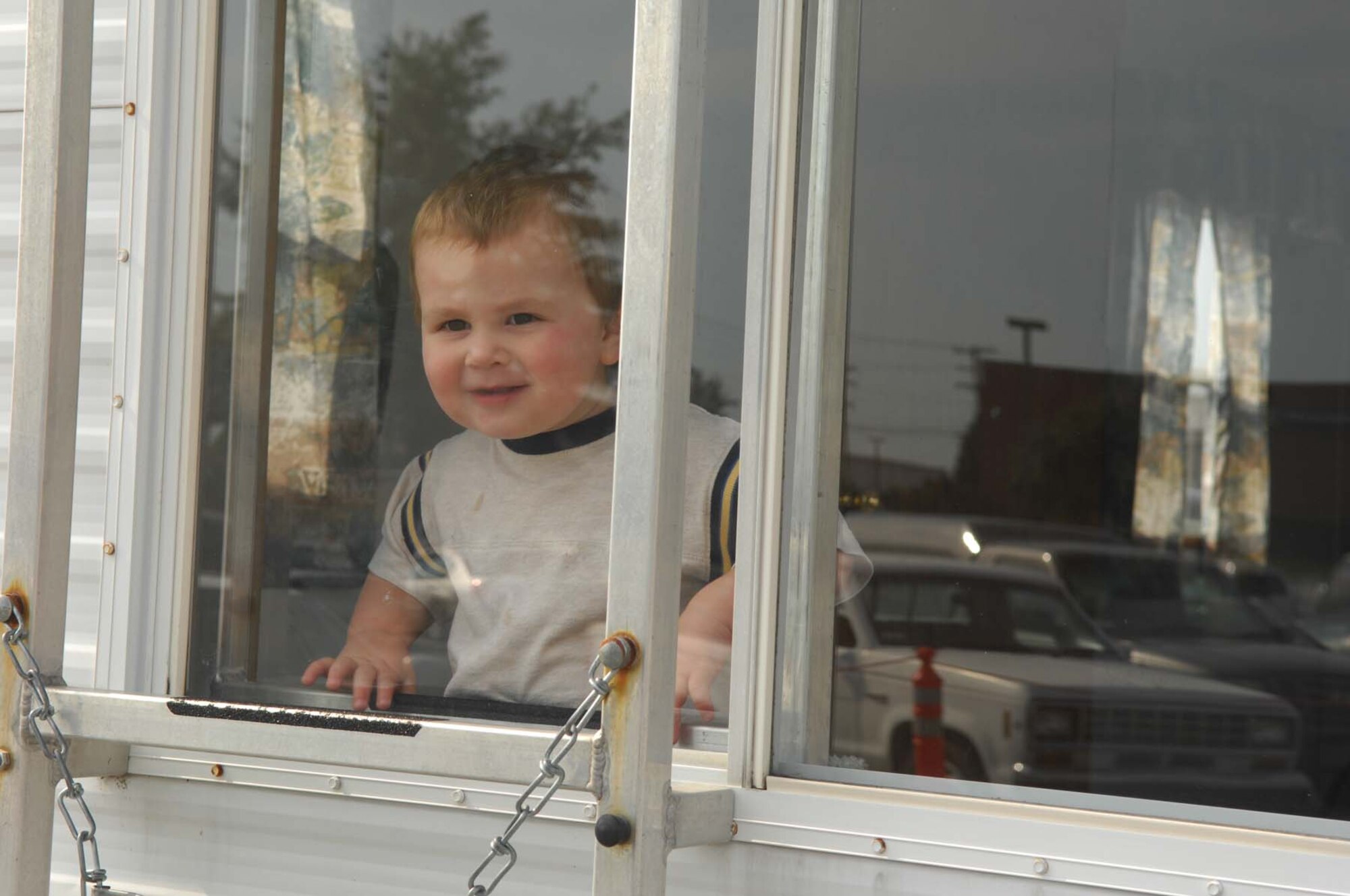 SHAW AIR FORCE BASE, S.C. -- Daniel Cantore watches the crowd from the 20th Civil Engineering Squadron Fire Protection trailer during the Shaw Community Awareness Day Oct. 4. The Shaw Community Awareness Day shows Airmen and families the 20th Fighter Wing personnel who provide support for the base. (U.S. Air Force photo/ Senior Airman Matthew Davis)  