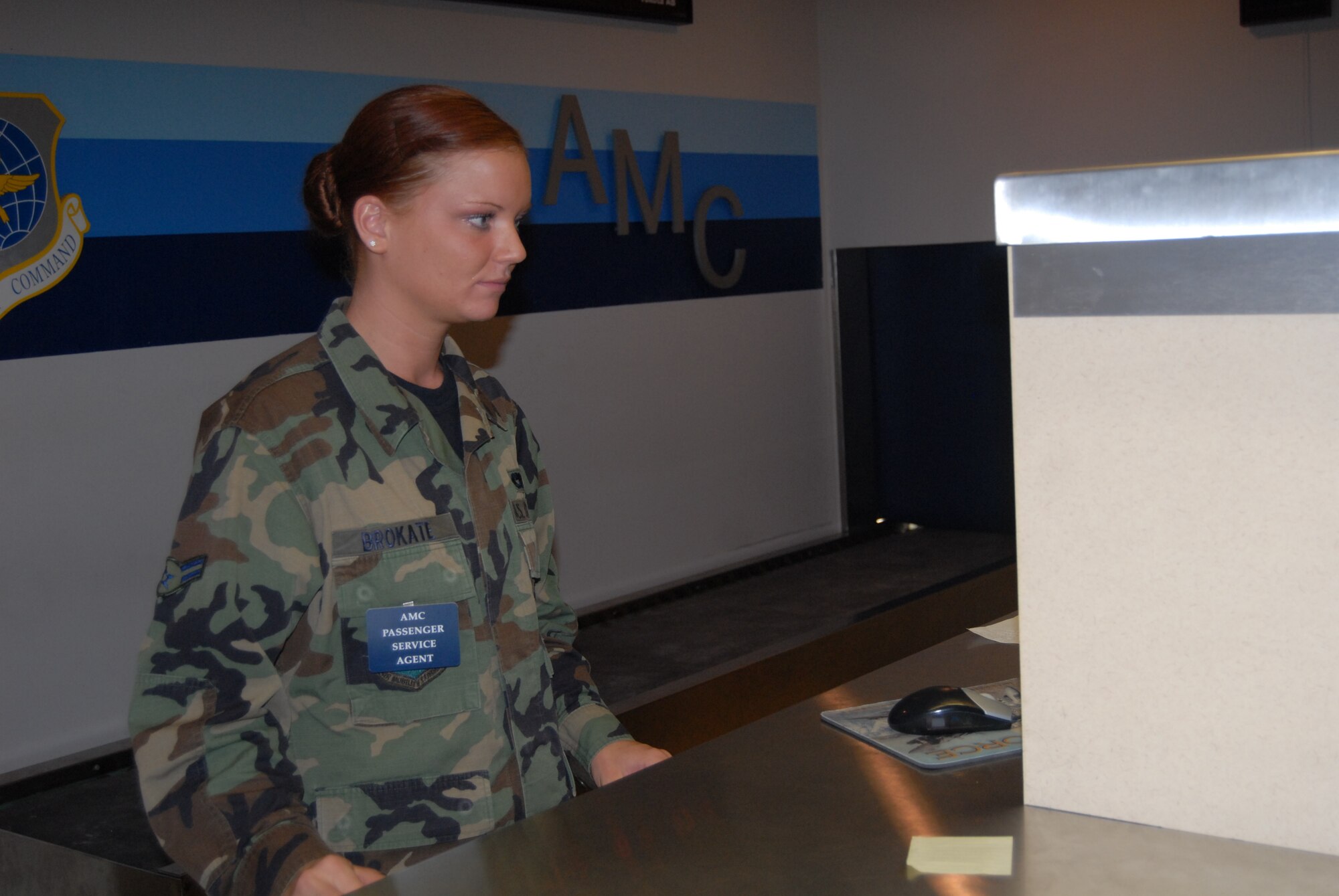 Airman 1st Class Christine Brokate, 3rd Aerial Port Squadron, works to prepare a flight manifest at Pope's Passenger Terminal. A flight manifest contains all passenger information for any given flight. (U.S. Air Force Photo by Emily Smith)