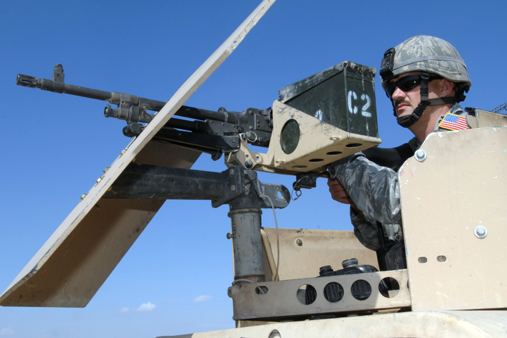 Tech. Sgt. Edward Akin, a mobile patrol fire team leader with the 506 Expeditionary Security Forces Squadron scans the fence line of bravo sector here, Oct 1, 2008. Sergeant Akin and his team are trained to provide an armed response capable to limit, counteract and neutralize hostile actions directed against the installation or its vital resources. Sergeant Akin is deployed from Barksdale Air Force Base, La., and calls Carthage, Texas home. (Air Force Photo/Tech. Sgt. Jeff Walston)  