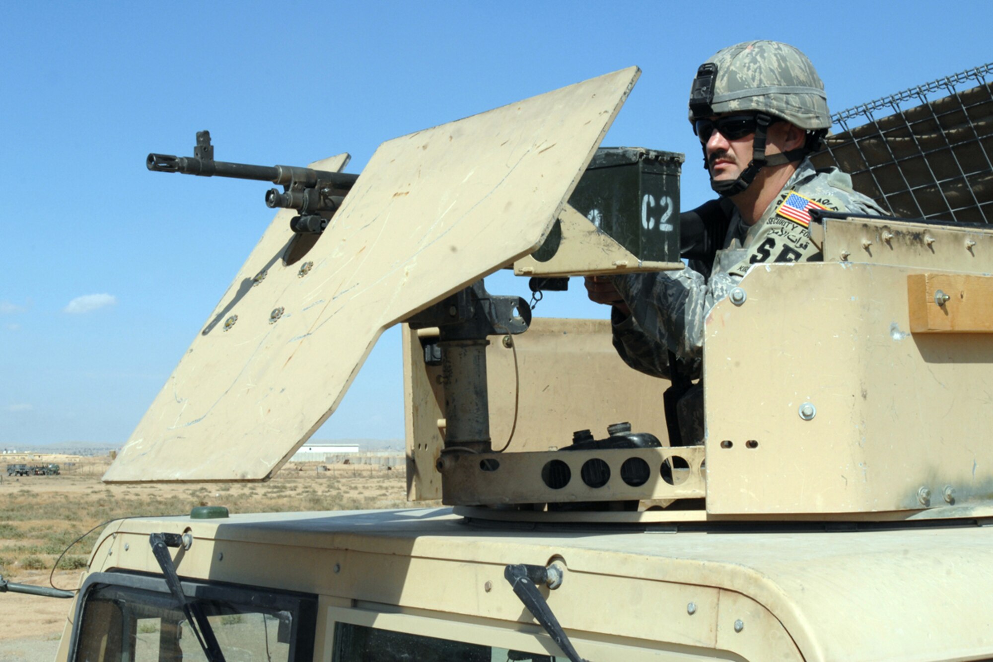 Tech. Sgt. Edward Akin, a mobile patrol fire team leader with the 506 Expeditionary Security Forces Squadron scans the fence line of bravo sector here, Oct 1, 2008. Sergeant Akin and his team are trained to provide an armed response capable to limit, counteract and neutralize hostile actions directed against the installation or its vital resources. Sergeant Akin is deployed from Barksdale Air Force Base, La., and calls Carthage, Texas home. (Air Force Photo/Tech. Sgt. Jeff Walston)  