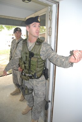 Staff Sgt. Russell Thompson, 43rd Security Forces Squadron, responds to a domestic scenario  as part of Domestic Violence Response training Sept. 22. More than 50 security forces members and Pope augmentees attended the training. (U.S. Air Force Photo by Staff Sgt. Jon LaDue)