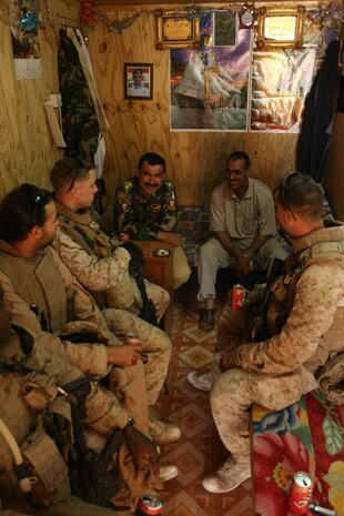 RAMADI, Iraq (Oct. 4, 2008) 2nd Lt. Kenneth A. Tarr, a platoon commander with Company C, 1st Bn., 9th Marines and 2nd Lt. James F. Smolucha, a platoon commander with 2nd Bn., 9th Marines talk with an Iraqi Army captain at an entry control point (ECP) Oct. 3. Tarr escorted Smolucha and his platoon to ECPs in their area of operations to familiarize them with where they will be working for the next seven months. (Official Marine Corps photo by LCpl. Jerry Murphy) (Released)