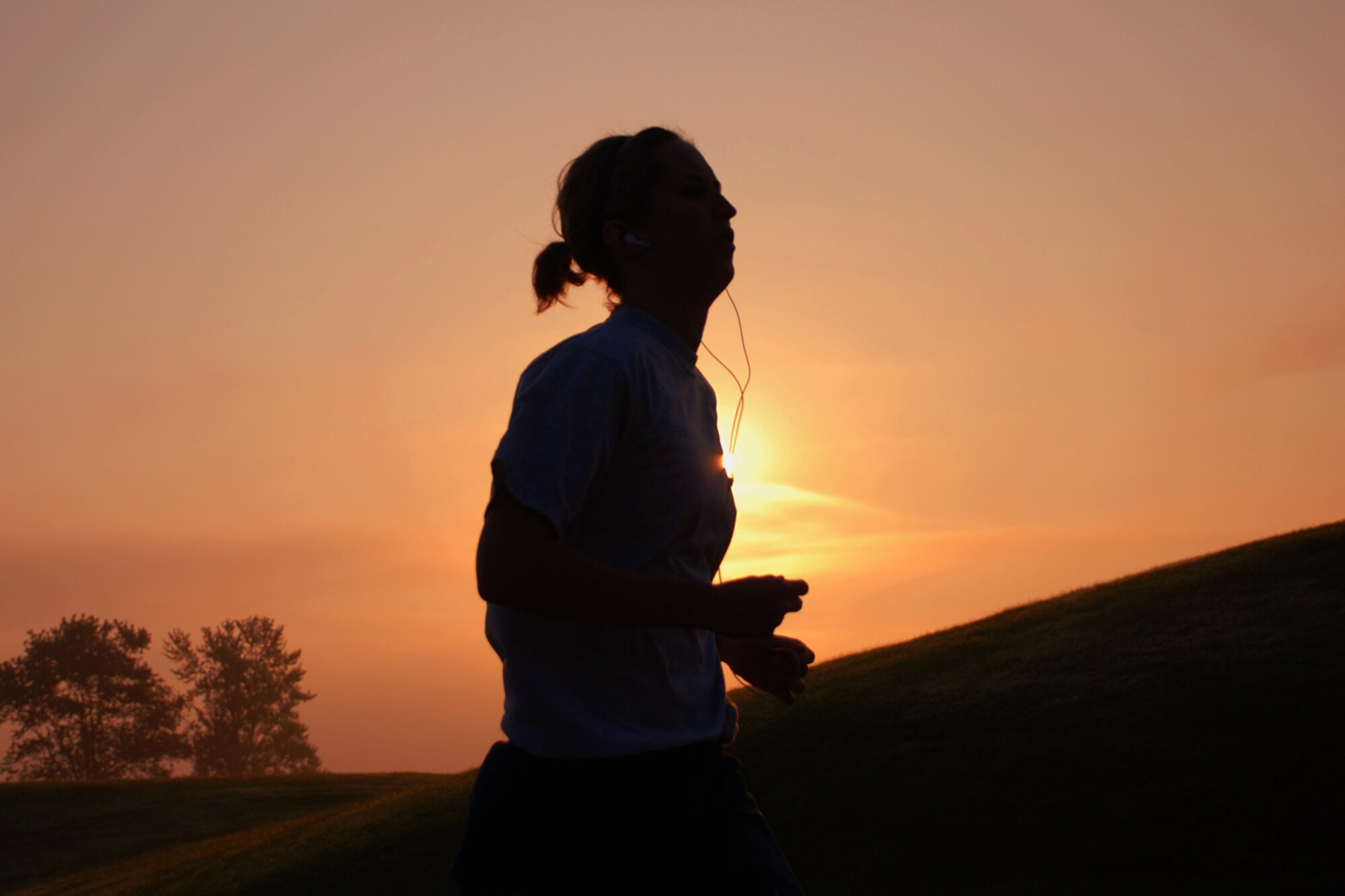 ANDREWS AIR FORCE BASE, Md. -- Capt. Mary Lloyd, 459th Security Forces Squadron commander, passes the sun during the fitnesst test run here Oct. 5. (U.S. Air Force photo/Tech. Sgt. Eric Sharman)