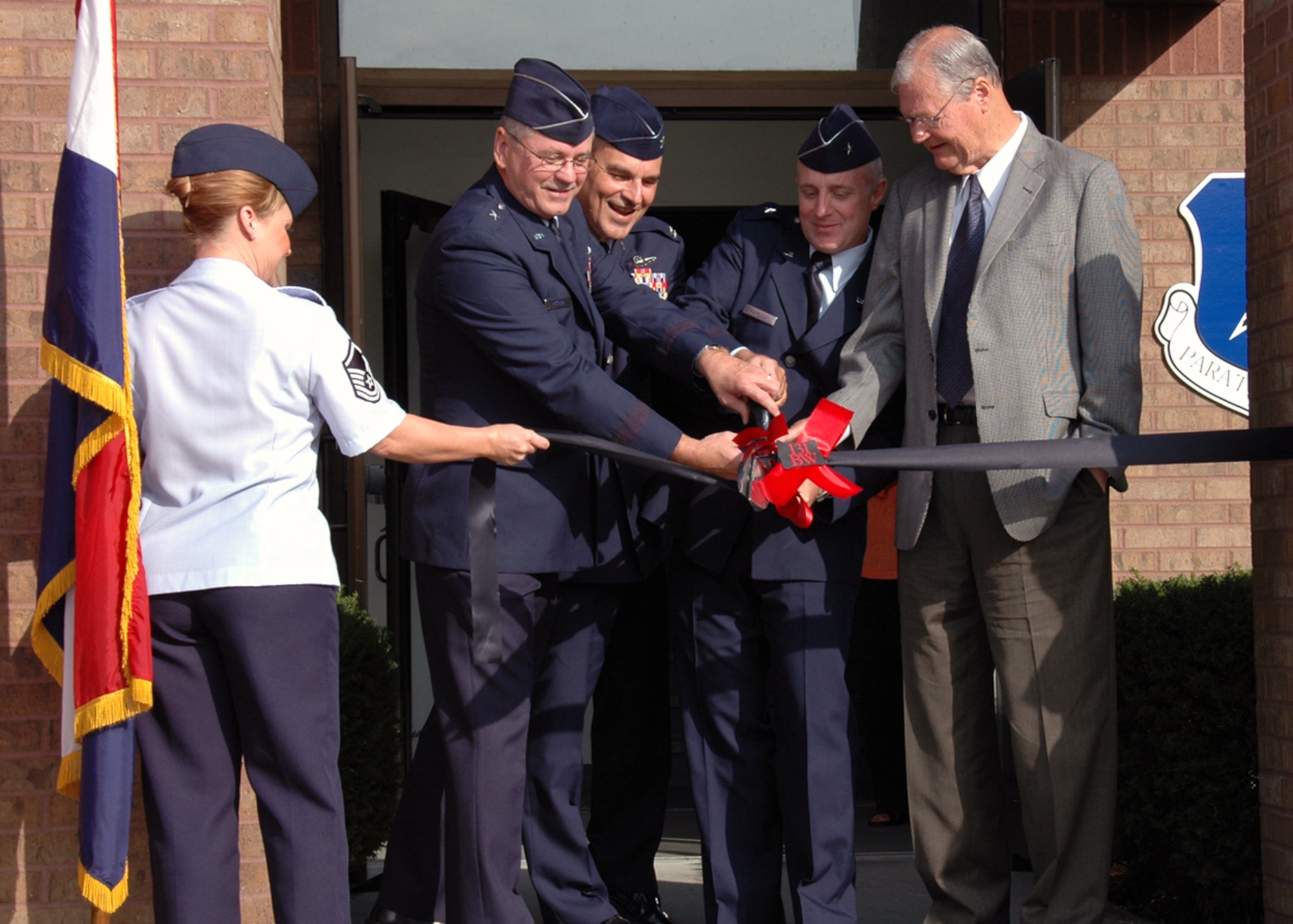 Brig. Gen. Craig D. McCord, Col. Robert L. Leeker, Brig. Gen. Garrett Harencak, and Congressman Ike Skelton participate in a ribbon cutting ceremony to commemorate the transition of the 131st Fighter Wing to the 131st Bomb Wing at Whiteman, AFB. (Photo By: Tech. Sgt. Megan Hunter)