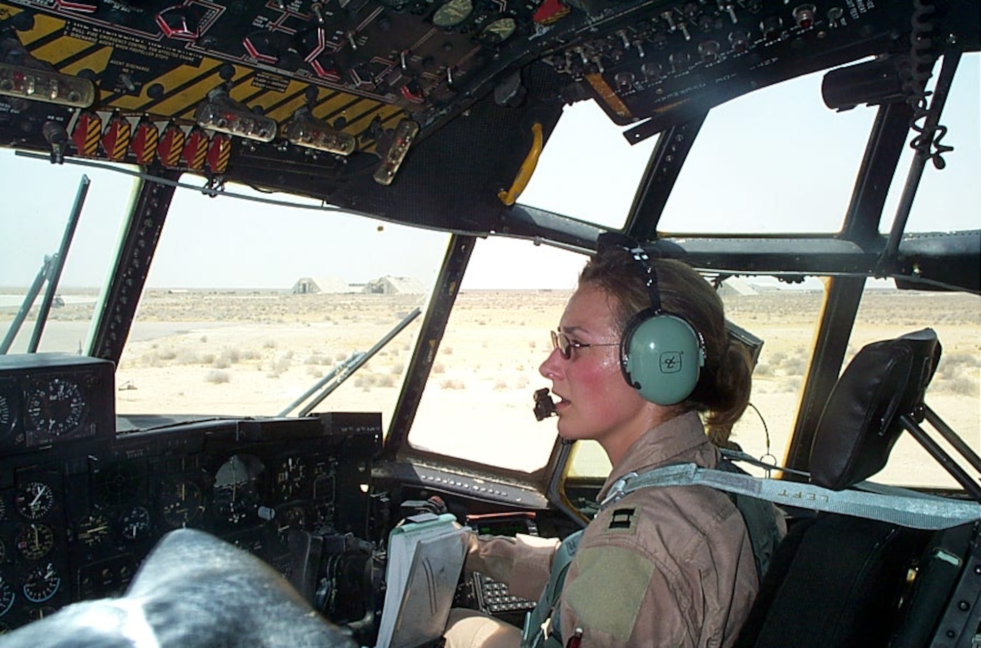 Maj. Kristen R. Snow, a Captain in the United States Air Force at the time of this photo, completes a combat air mission in an HC-130 at a forward operating base in Southwest Asia in direct support of Operation Enduring Freedom.  (Photo courtesy of Maj. Kristen R. Snow)