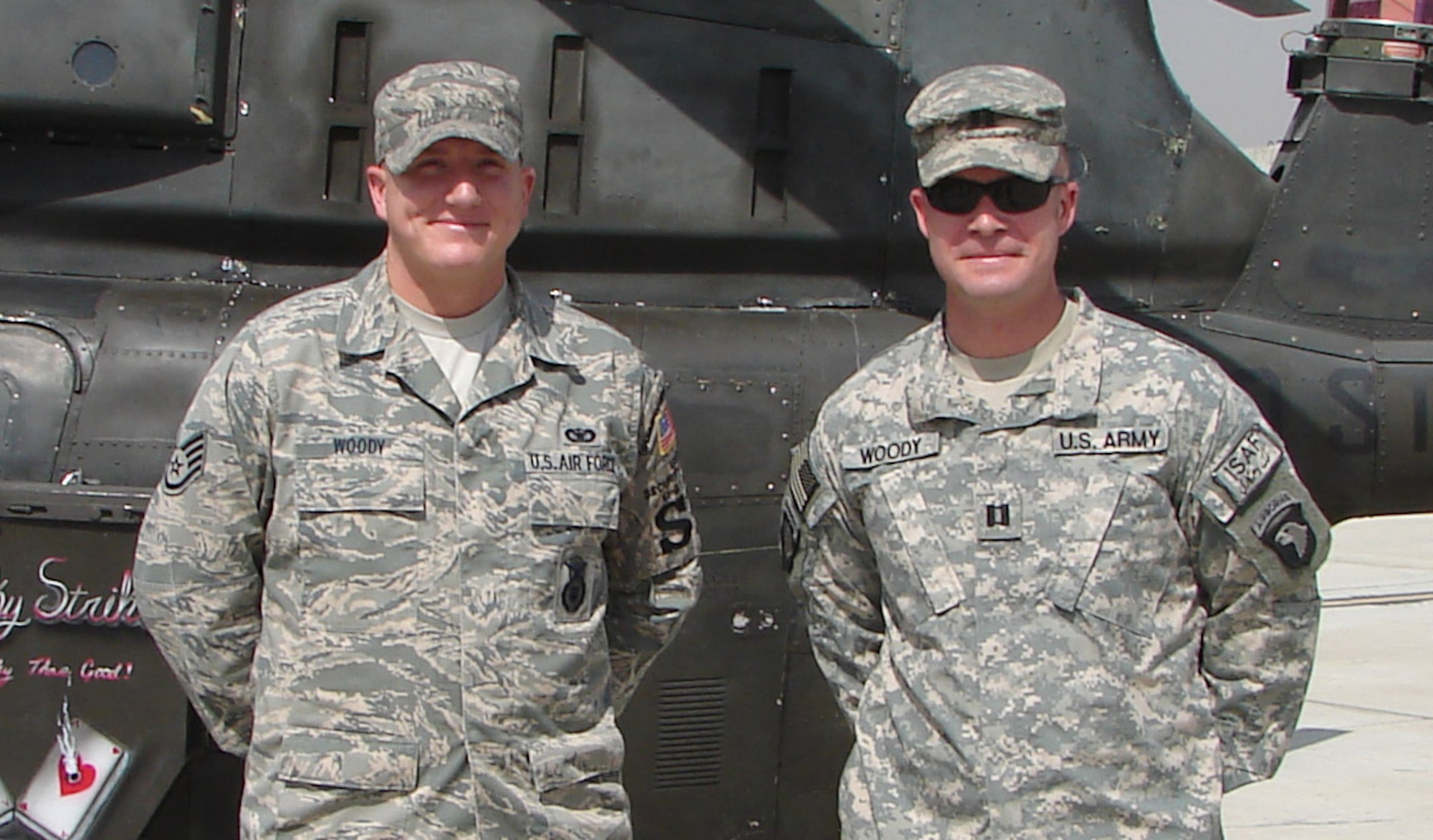 Army Capt. Bryan Woody meets his brother Staff Sgt. Justin Woody of the 157th Air Refueling Wing at Bagram Air Base Afghanistan while deployed Sept. 30. Capt. Woody re-enlisted his brother and three other members of the 157th Air Refueling Wing.