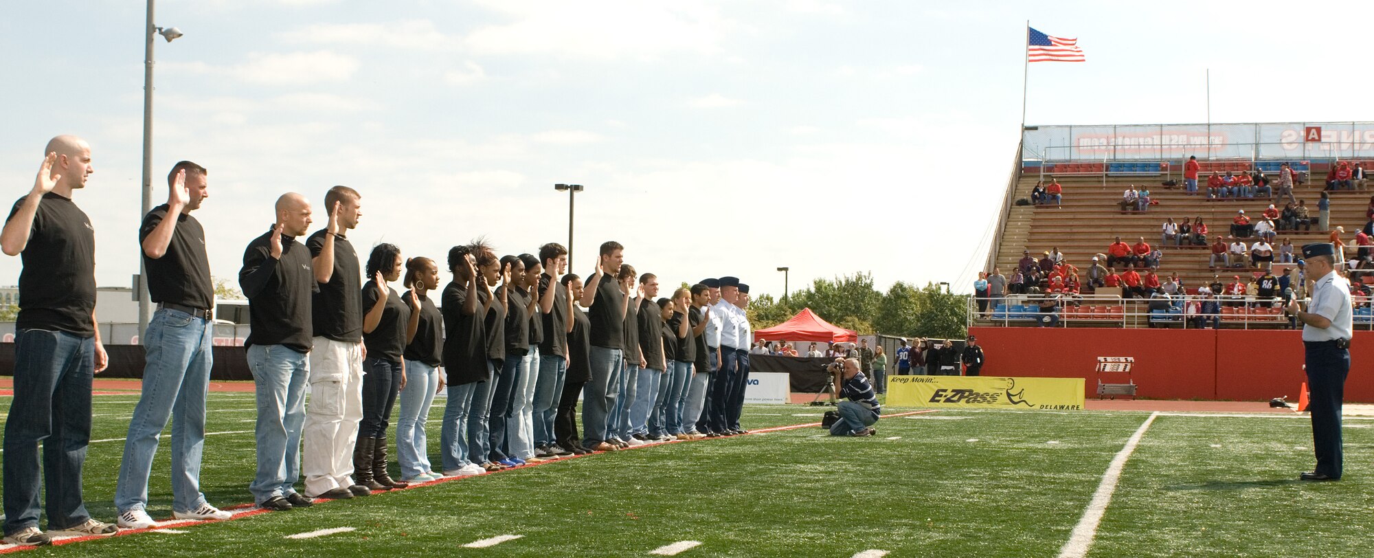 Col. Randal L. Bright (right), 512th Airlift Wing commander, administered the oath of enlistment Oct. 4 at the Delaware State University football field to 19 individuals ranging in age from 17 to 35. From all around Delaware and as far as Norfolk, Va., these people became the newest members of the Air Force Reserve. Some of the job specialties they will be assigned to include aircraft loadmasters, cargo handlers and fuels. This mass enlistment ceremony was part of a nationwide effort to conduct mass enlistments in October throughout the Air Force Reserve Command. 
