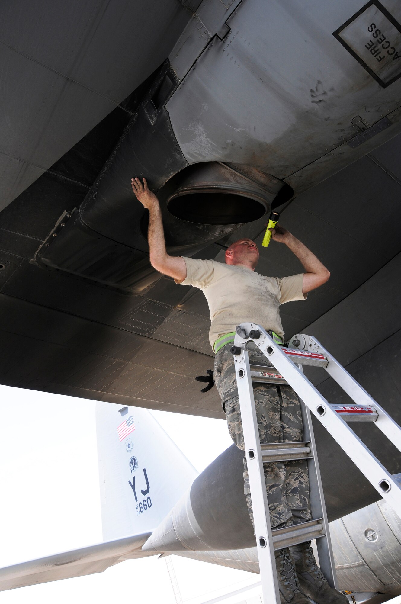 Tech. Sgt. Bryan Harris, 379th Expeditionary Aircraft Maintenance Squadron, 746th Aircraft Maintenance Unit, performs an exhaust inspection on a C-130 Hercules October 3, 2008.  Sgt Harris checks for leaks and cracks following an engine test after repair at an undisclosed air base in Southwest Asia.  Capable of takeoffs and landings from unprepared runways, the C-130 was originally designed as a troop, medical evacuation, and cargo transport aircraft. The versatile airframe has found uses in a variety of roles and humanitarian aid operations throughout the area of operations.  Sergeant Harris, a native of Binghamton, N.Y., is deployed from Yokota AB, Japan, in support of Operations Iraqi and Enduring Freedom and Joint Task Force-Horn of Africa.  (U.S. Air Force photo by Tech. Sgt. Michael Boquette/Released)