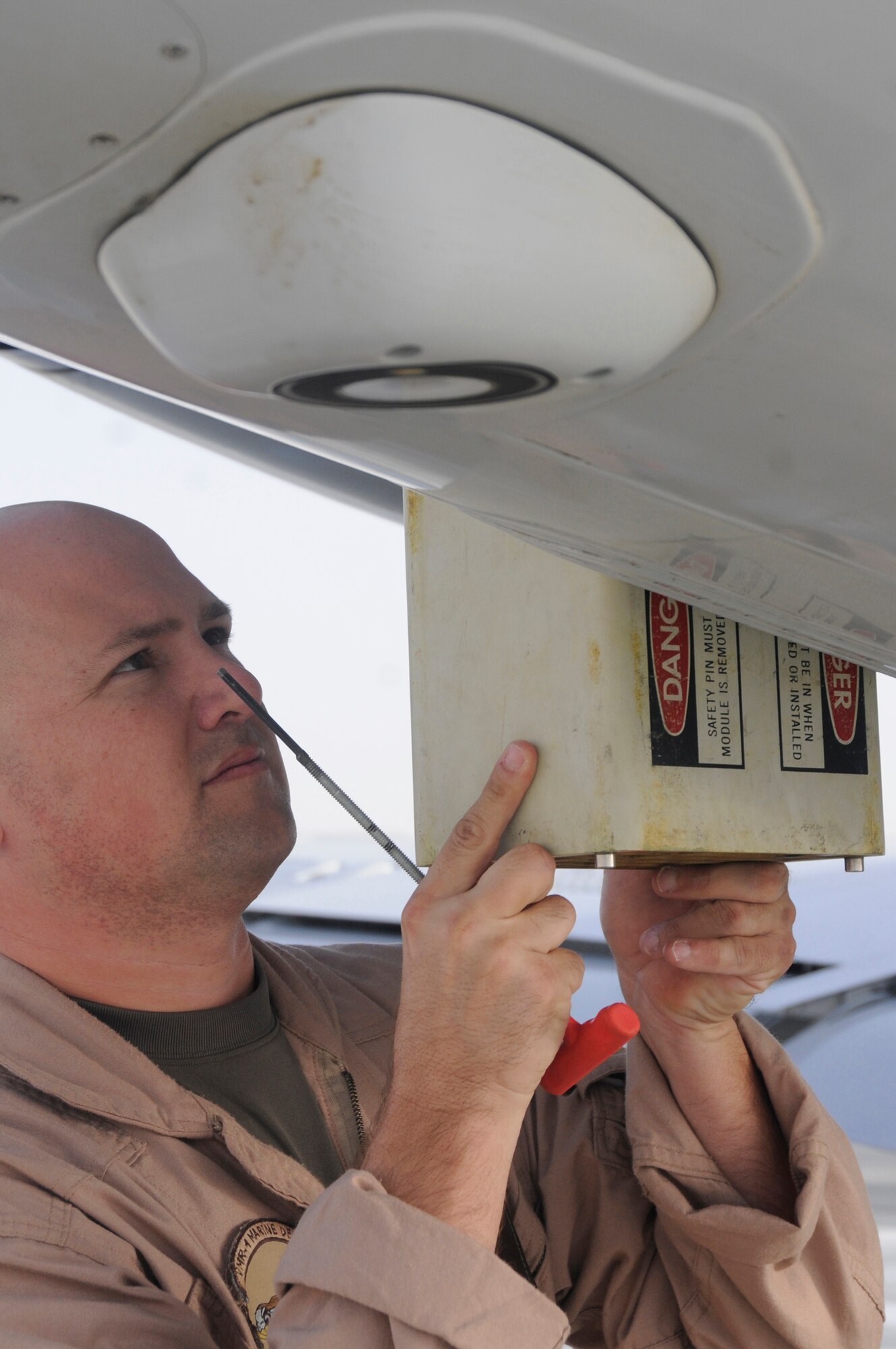 Sgt. Joshua Shirley, ordinance technician assigned to Marine Transportation Squadron 1, loads flare into a compartment of a UC-35 Oct. 3, 2008, at an undisclosed air base in Southwest Asia.  The UC-35 provides senior warfighting commanders and their staffs executive transportation to meet and concord with other governments in support of Operations Iraqi and Enduring Freedom and Joint Task Force-Horn of Africa. Sergeant Shirley, a native of Columbia, S.C., is deployed from Marine Corps Air Station Cherry Point, N.C. (U.S. Air Force photo by Staff Sgt. Darnell T. Cannady/Released)