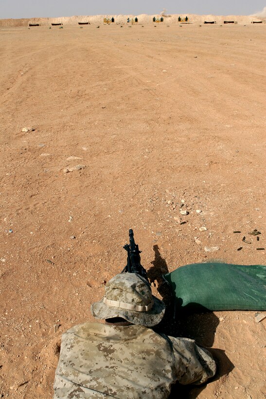 Cpl. Zachary A. Lira, a scout sniper with Headquarters and Service Company, 1st Light Armored Reconnaissance Battalion, Regimental Combat Team 5, fires at targets on a range at Camp Korean Village, Iraq, Oct. 5. â??The fundamentals we as Marines have learned from the beginning, such as using bone support or the natural respiratory pause, are the same tools we use as snipers,â? said Lira.::r::::n::