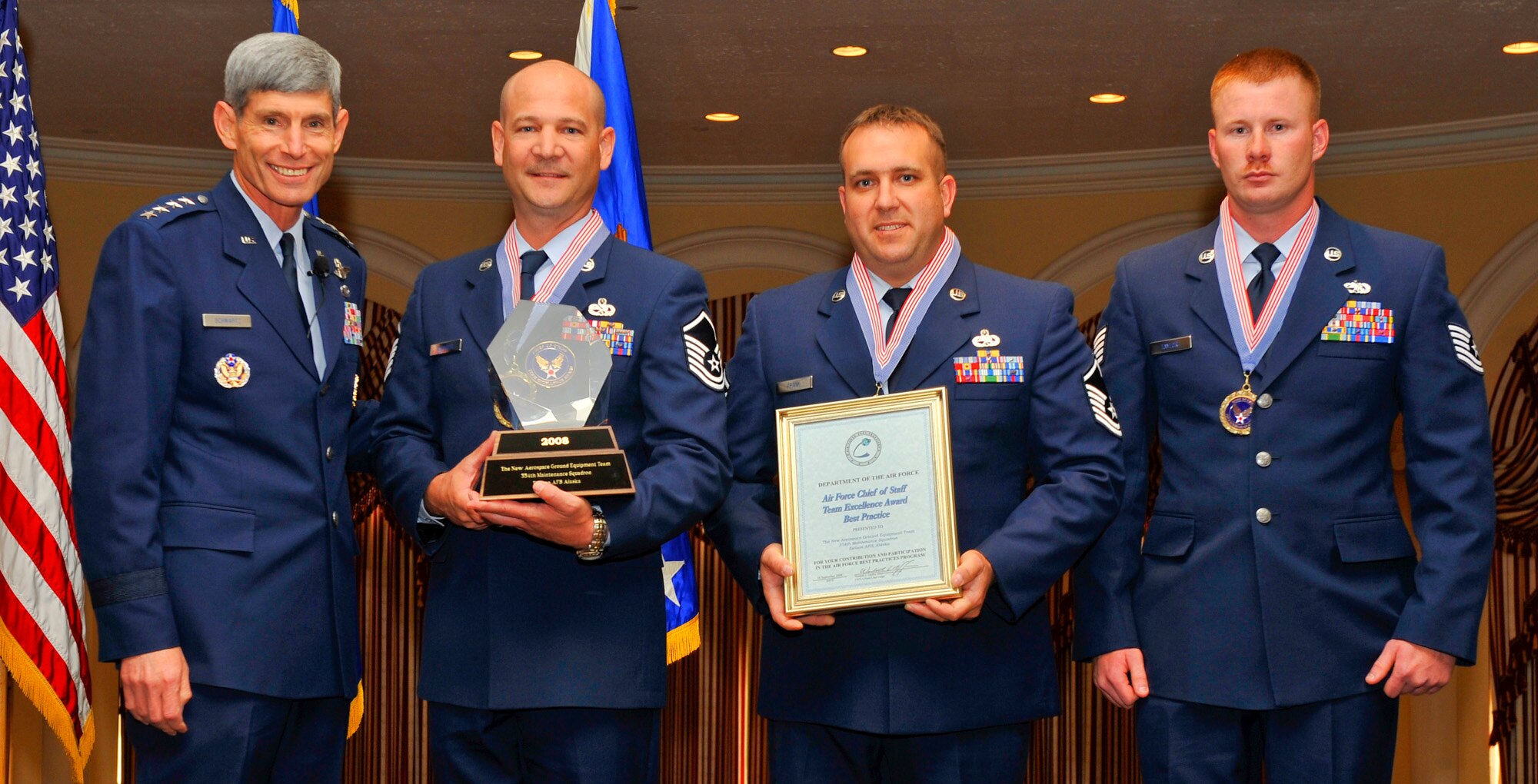 The 354th Maintenance Squadron New Aerospace Ground Equipment flight, was awarded the 2008 Chief of Staff Team Excellence Award Sept. 16, 2008, in Washington D.C. by the Chief of Staff himself, Gen. Norton A. Schwartz. Pictured here are Master Sgts. Matthew Hopwood and Bret Frank and Tech. Sgt. Daniel Taylor. (U.S. Air Force photo by Michael Pausic)
