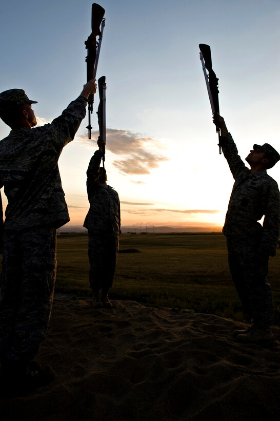 (From left) Airman 1st Class Ray Wahl, Staff Sgt. Ruben TrejoSanchez and 1st Lt. Erik Ruiz, Ellsworth Air Force Base Honor Guard Drill Team members, practice the liberty position during drill practice here, Oct. 3. The drill team personifies the integrity, discipline, teamwork, and professionalism of every Airman. (U.S. Air Force photo/Senior Airman Marc I. Lane)
