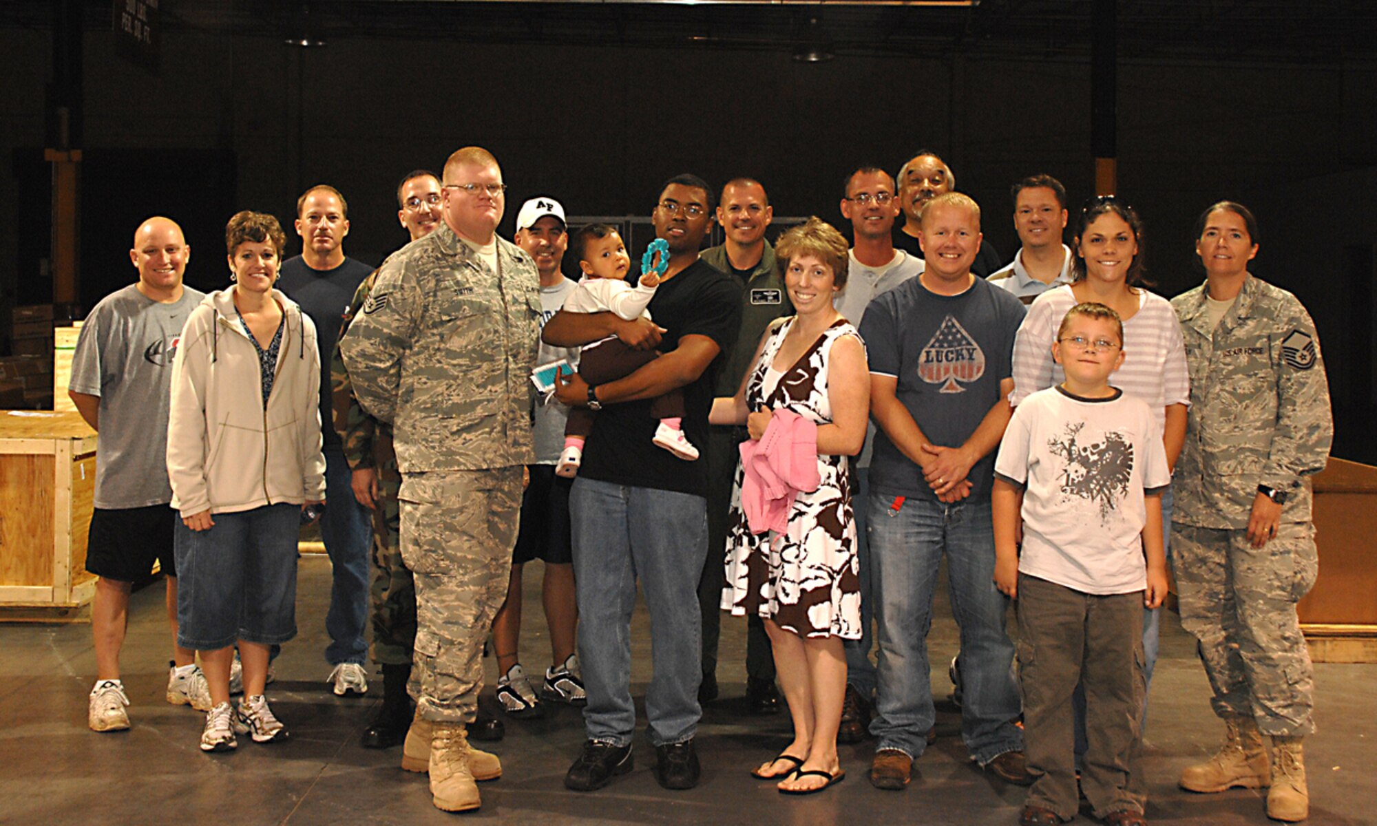 Members of Team Holloman pose for a photo after welcoming home four members of the 49th Logistics Readiness Squadron at Holloman Air Force Base, N.M., October 5. The personnel were on a six month deployment to Camp Salerno Afgahnastan. (U.S. Air Force photo/ Senior Airman Tiffany Trojca)
