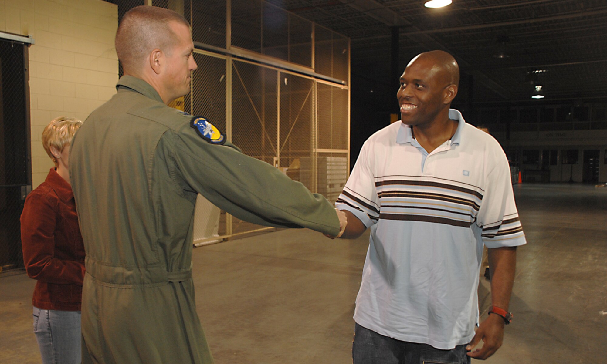 Master Sgt. James Redmond, 49th Communications Squadron, is welcomed back from a six month deployment by Col. Michael McGee, 49th Fighter Wing vice commander at Holloman Air Force Base, N.M., October 5. (U.S. Air Force photo by/ Senior Airman Tiffany Trojca)