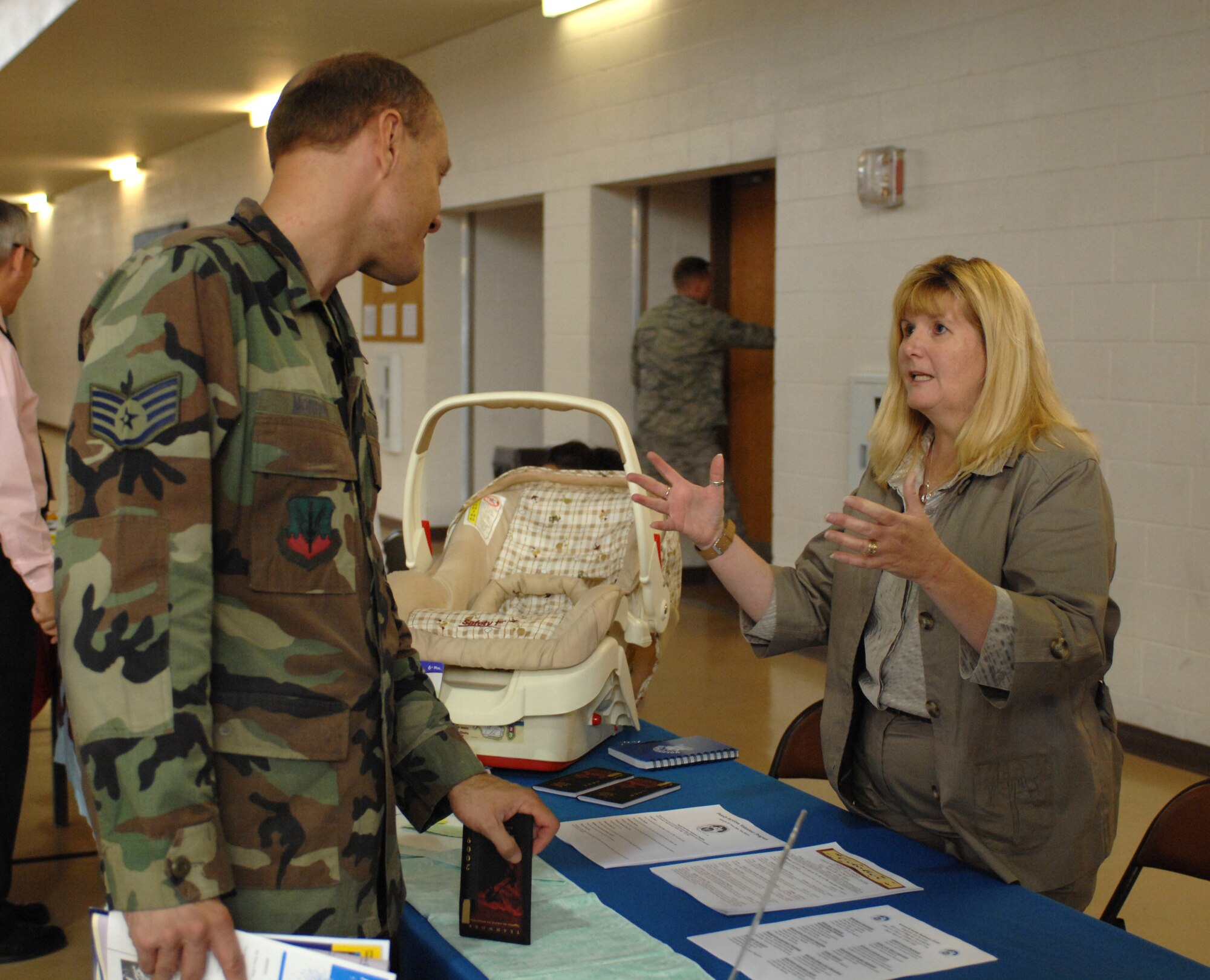 Staff Sgt. Brian Morrow, 49th Materiel Maintenance Support Squadron, checks out the Airmen and Family Readiness Center booth set up at the annual Combined Federal Campaign Kickoff at the Fitness and Sports Center at Holloman Air Force Base, N.M., October 3. Holloman?s goal this year is $70,000, and can be attained if each Airmen donates one dollar a paycheck. (U.S. Air Force photo/Airman Sondra M. Escutia)