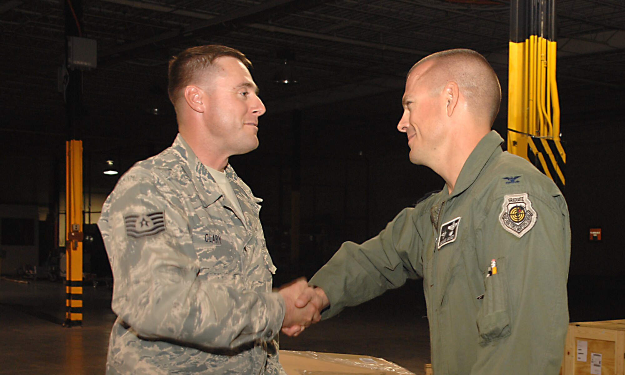 Tech. Sgt. Shawn Clary, 49th Medical Support Squadron, is greeted by Col. Michael McGee, 49th Fighter Wing vice commander at Holloman Air Force Base, N.M., October 5. Sergeant Clary was on a four month deployment to Bahgram Afgahnastan. (U.S. Air Force photo/ Senior Airman Tiffany Trojca)