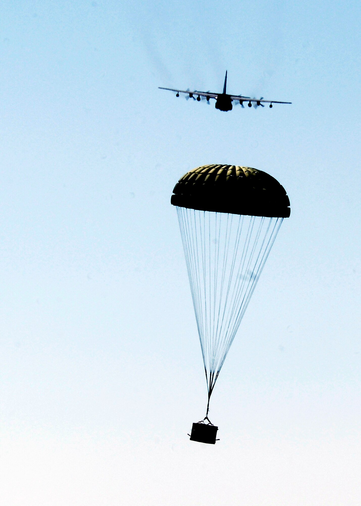 An MC-130W Combat Spear drops a container release system load at Melrose Air Force Range, N.M., during a training exercise Sept. 23. The drops are done at least once a week and prepares the aircrews for resupply missions in areas that have no airfields. (U.S. Air Force photo/Airman 1st Class Evelyn Chavez)