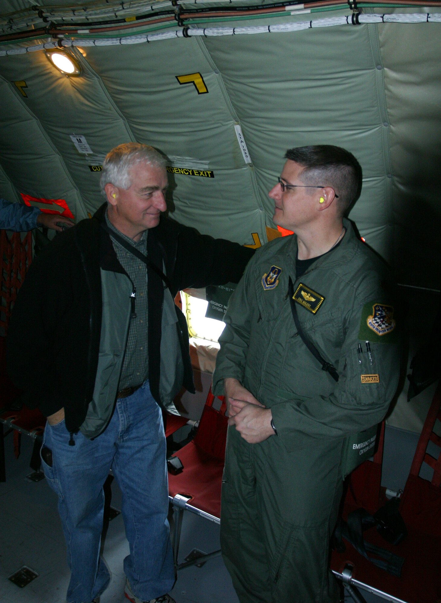 Maj. Eric Mulert, a pilot with the 466th Fighter Squadron, chats with Dale Pfister, principal of Roy High School, while onboard a KC-135. Civilian employers of traditional reservists were treated to the mid-air F-16 refueling, courtesy of the Utah Air National Guard unit in Salt Lake City, as part of the 419th Fighter Wing’s annual Employer Appreciation Day Saturday, which also included a catered lunch provided by the local chapter of the Employer Support of the Guard and Reserve, and an open-cockpit F-16 static, among other events. (U.S. Air Force photo/Staff Sgt. Kyle Brasier) 