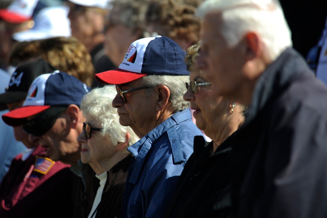 Members of the Berlin Airlift Veterans Association look on as 31 names of Airmen who fell in the airlift are called at the South Dakota Air and Space Museum, Oct. 3. A display case and a plaque were two memorials unveiled at the ceremony to commemorate the Berlin Airlift's 60th anniversary. (U.S. Air Force photo/Airman Matthew Flynn)