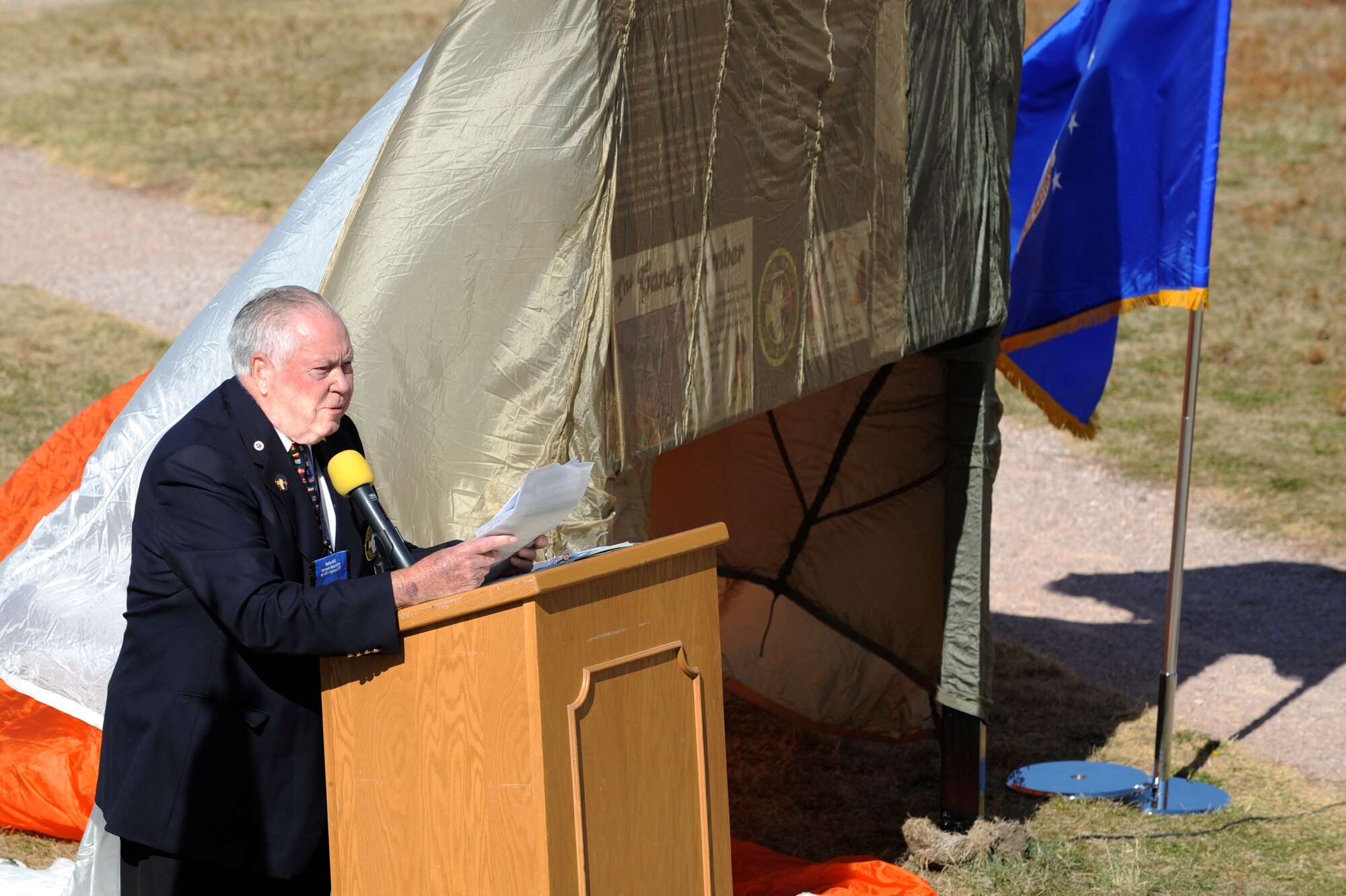 Dr. Earl Moore, Berlin Airlift Veterans Association president, speaks before the unveiling of an outdoor plaque at the South Dakota Air and Space Museum Oct. 3. The plaque showcases a brief history of the airlift and several photos from the operation, which spanned from June 24, 1948 to May 12, 1949. (U.S. Air Force photo/Airman Matthew Flynn)
