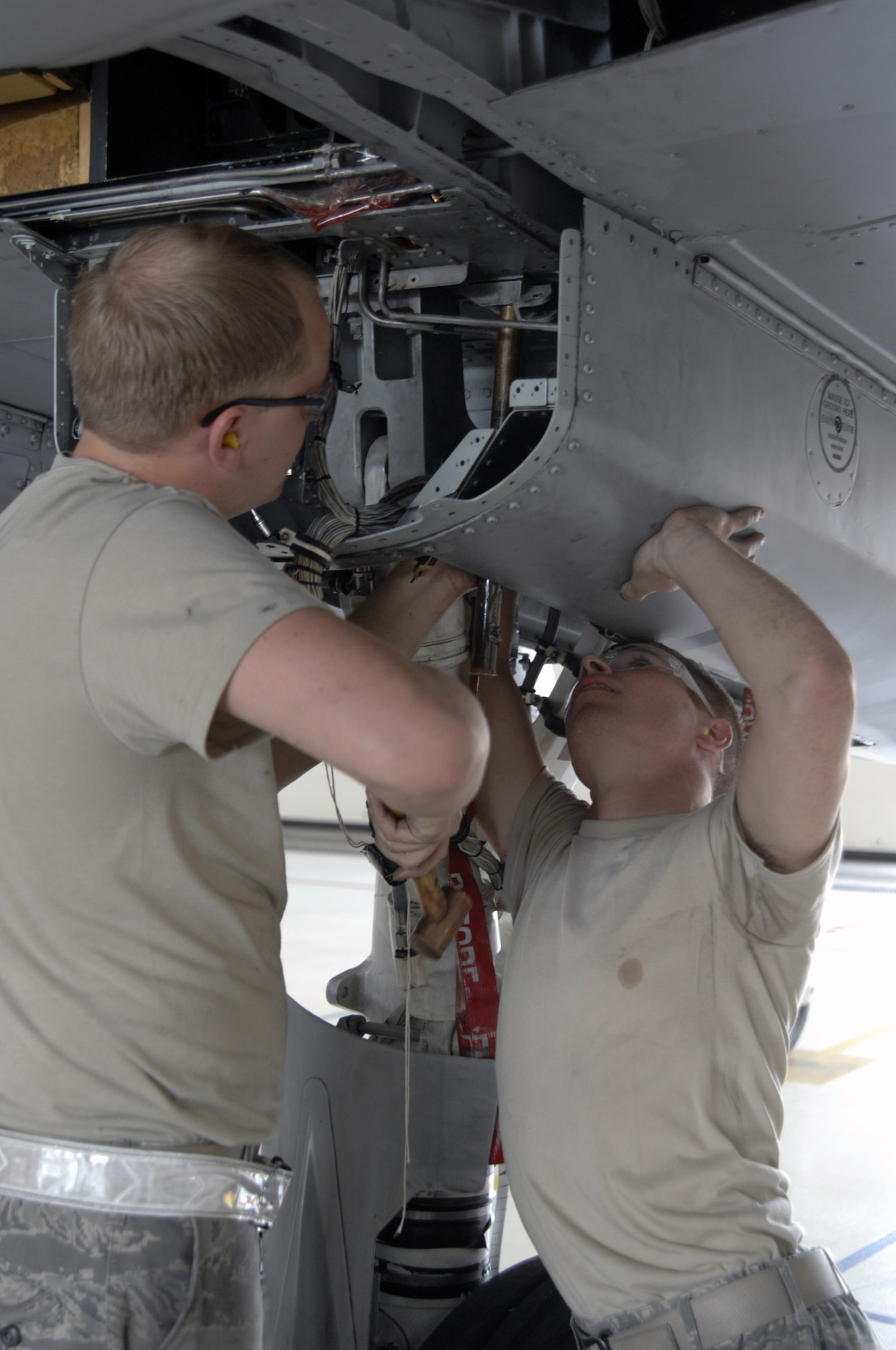 Senior Airman John Grable (left) and Airman First class Talmadge Borthwick prepare to inspect an A-10 Thunderbolt II for wing frame cracks Oct. 4 at Moody Air Force Base, Ga.  A Time Compliance Technical Order was issued by Air Force Materiel Command officials identifying certain A-10s that needed to be inspected.  The two Airmen are assigned to the 23rd Equipment Maintenance Squadron at Moody AFB.  (U.S. Air Force photo/Senior Airman Javier Cruz) 