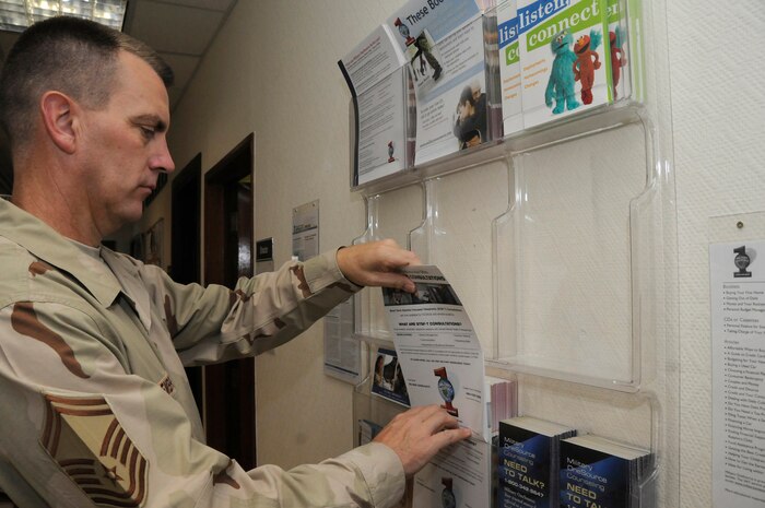 Senior Master Sgt. Grant Embrey restocks pamphlets for customers here Sept. 22. Sergeant Embrey and the other ARC members maintain the only Airmen Readiness Center in the entire area of responsibility. Sergeant Embrey is superintendent of the 379th Expeditionary Force Support Squadron Airmen Readiness Center. (U.S. Air Force photo/Staff Sgt. Darnell T. Cannady)
