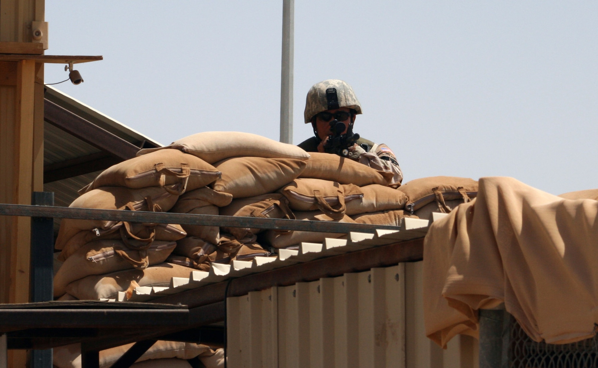 Staff Sgt. Jojo Garcia mans a post at a Southwest Asia base Oct. 1. The 64th Air Expeditionary Group there provides force protection and base support to enable U.S. security assistance operations and enhance strategic partnerships. The group is 72 percent Guard, 25 percent active duty, and 3 percent Air Force Reserve, exemplifying total force and joint concepts. Sergeant Garcia is Air National Guard member with the 64th Expeditionary Security Forces Squadron. (U.S. Air Force photo)