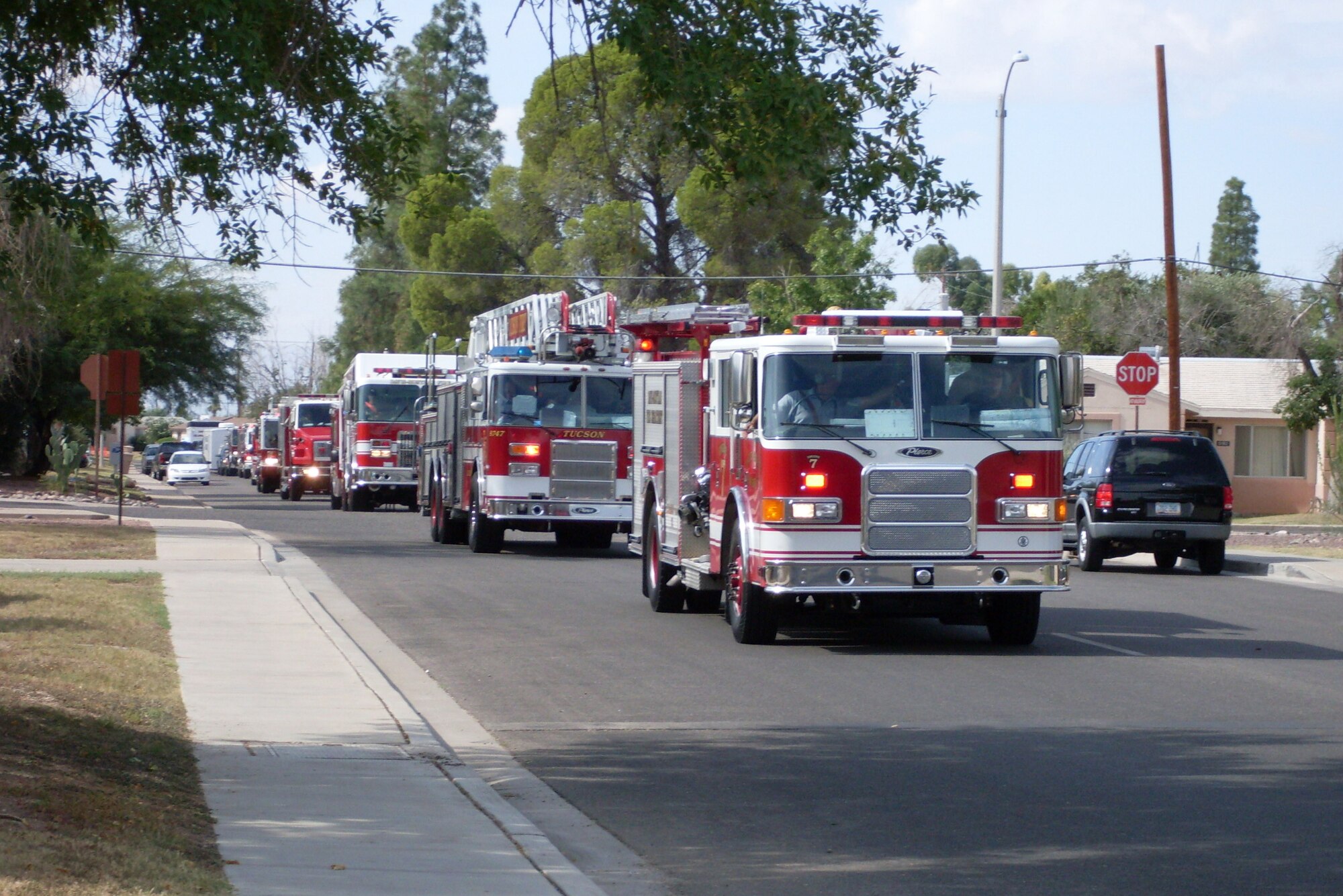 Fire trucks drove around the base Oct. 4 during the Fire Prevention Week Parade that kicked off the Annual National Fire Prevention Week Campaign. The parade featured a variety of different style fire trucks. (U.S. Air Force photo by Airman 1st Class Jamie L. Coggan)