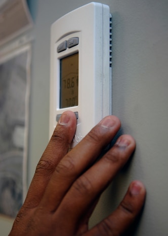 In the winter, set the thermostat at 68 degrees in daytime; in the summer, keep it at 78.  By exercising a few steps, families can cut annual emissions by thousands of pounds and energy bills by a significant amount. (U.S. Air Force photo/Airman 1st Class Katie Gieratz)